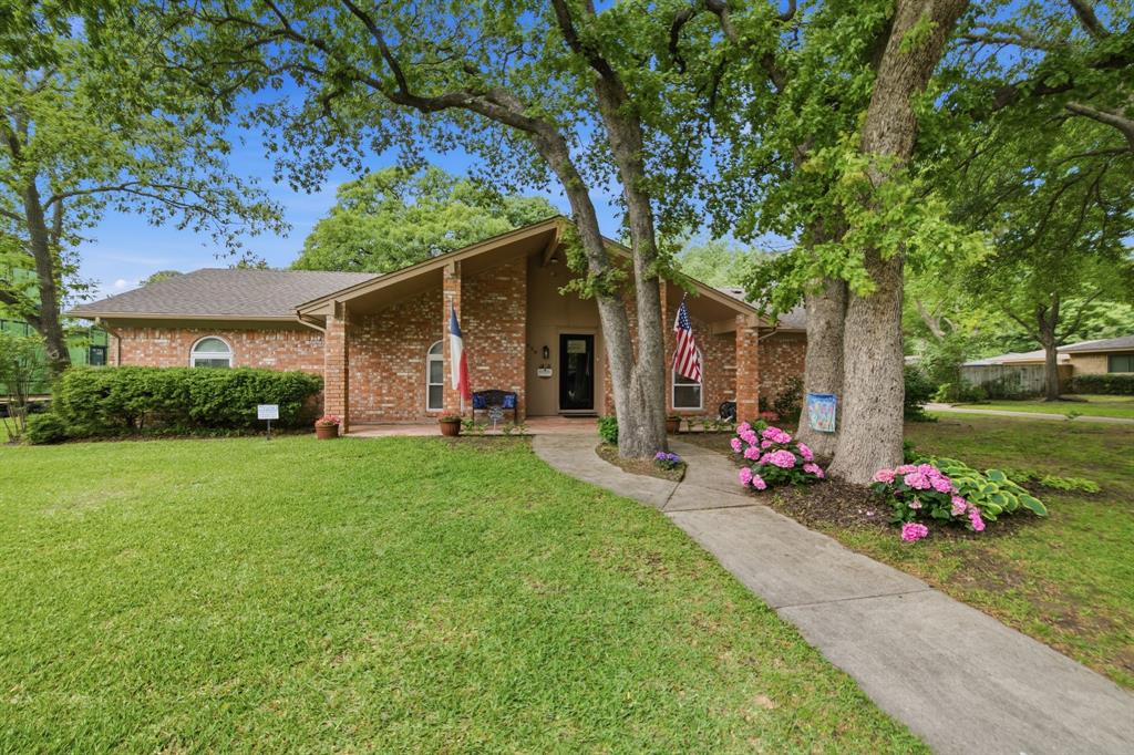 Situated on a beautifully manicured .49-acre lot, this FULLY UPDATED Southlake residence offers the perfect blend of timeless curb appeal and modern upgrades. This stunning home presents 1858 square feet of reimagined living spaces including an oversized family room, a chef's kitchen with an adjacent dining area, three private bedrooms, two remodeled bathrooms, a charming sunroom, utility area, workshop, a two-car garage with additional space for a recreational vehicle and a dedicated 240V EV charger under carport area. As one is ushered into the home through a charming entry, they are greeted by an open living room with a vaulted ceiling and a stunning wood burning fireplace with brick surround. Stately wood-inspired laminate flooring flows through the main room while gracious custom built-ins give this room timeless character. Open to the family room, the remodeled kitchen boasts new stainless-steel appliances, custom granite counters, dual ovens, subway tile backsplash, custom cabinetry, a functional breakfast bar and a generous dining area with an upgraded chandelier. The primary suite is showcased by a luxurious bathroom. Two additional bedrooms, a fully remodeled second bathroom, a dedicated sitting area and a large utility room complete the floor plan. As an added bonus, there is a sunroom with gracious windows creating the perfect place to enjoy morning coffee. With towering trees, the extraordinary backyard oasis offers an open canvas with plenty of room for play. The backyard hosts a 12x16 workshop complete with electricity and plumbing. Additional upgrades include new windows, fresh wall textures, designer paint, updated flooring, custom cabinetry, upgraded light and plumbing fixtures, smart home wiring, a replaced water heater, septic-to-sewer conversion, access to a private well feeding the irrigation system, no required HOA, and more. This home is zoned for Keller ISD but also offers the opportunity for open enrollment into Carroll ISD.