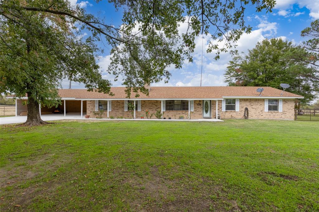 Beautiful East Texas sandy soil grass producing Ranch with spacious 4 BR-2.5 bath Brick Home and in ground pool. The newly painted home offers split bedrooms with a ex-large master and walk in closet. Spacious family room has stone fireplace with insert and open to dining and kitchen. Step out to the glassed in sun porch (great for plants or year round entertaining) that opens on up to the covered porch and in ground Gunite  swimming pool. Enjoy this expanded entertaining area overlooking improved grass pastures and nearly 2 ac lake with shade trees for picnicking or relaxing. This property is fenced and cross fenced with a older dairy barn. The property also has an older well, that sellers have not used recently. A new extra wide concrete drive leads up to a 3 car covered parking providing plenty of additional parking. The front of the house has nice well maintained flowerbeds and beautiful shade trees. 
This peaceful home with acreage is located in the Como Pickton CISD.