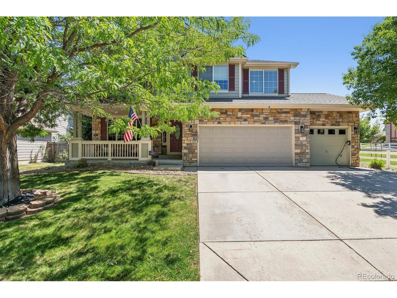 Tucked alongside open space and scenic trails, this thoughtfully updated 4-bedroom, 3-bath home pairs distinctive design with modern technology and flexible living spaces. Soaring ceilings, oversized windows and an open upper-level overlook fill the home with natural light, while curated finishes, upgraded lighting, black hardware & Art Deco-inspired details give the interior a style all its own. Formal living and dining provide room to gather and entertain, while the dramatic two-story living room centers around a gas fireplace with geometric tile. A private main-level office with French doors, recessed lighting and a smart Wi-Fi ceiling fan creates an ideal work-from-home retreat. The refreshed kitchen combines style and functionality with Carrara Breve quartz, a Delta workstation sink and LG SMART appliances, including a double-oven range with ProBake Convection, refrigerator with Craft Ice and ultra-quiet QuadWash dishwasher. Dual heating and cooling zones with smart thermostats add everyday comfort and convenience. Upstairs, plush carpeting leads to a spacious loft with custom built-ins, ideal for a library, media room or additional workspace. The primary suite offers a paneled accent wall, room-darkening shades and upgraded closet organization. The unfinished basement adds possibilities with carpeting, recessed lighting, natural light and plumbing roughed in for future finishing. The three-car garage is equally impressive with EV charging, smart garage access, a ceiling-mounted heater, high-voltage outlets, built-in workstations and storage. Outside, a pergola-covered kitchen with built-in JennAir grill and integrated seating creates a natural gathering place. A recently painted deck, mature privacy trees, raised garden beds, fenced yard and direct access to a paved neighborhood trail embrace the Colorado lifestyle. Extensively refreshed in 2023, this Fort Collins home brings together personality, thoughtful upgrades, connected technology and access to nature.