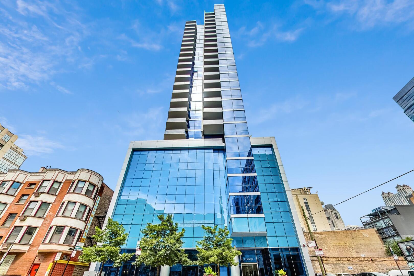 Meticulously upgraded 2 bed 2 bath city haven in a River North's Blue Gem boutique high-rise! Enter into an expansive living space with floor-to-ceiling windows and sweeping city views. The Chef's kitchen features beautiful custom Snaidero cabinetry, Sub-Zero paneled refrigerator with double freezer drawers, Wolf stove top/oven/microwave, double dishwasher drawers, granite counter tops, custom antiqued glass backsplash and island surround, & LED ambient up-lighting. The primary suite was professionally designed with custom built-ins providing an abundance of storage. The spa-like ensuite bathroom boasts Grohe fixtures, a double vanity, marble tile and counters, a jacuzzi tub with glass doors, heated floors, and built-in linen storage. The second bedroom is customized with a motorized Murphy bed with added storage allowing for the perfect work-from-home environment, as well as, the perfect space for guests. The second bathroom offers a walk-in shower with glass door, a custom inlayed mirror, heated floors & designer lighting. Step out onto the oversized balcony with stunning east, north, and west city views. Additional unit upgrades include Bamboo hardwood flooring throughout, built-in surround sound ceiling speakers, motorized roller shades, two HVAC systems & secondary baseboard heating throughout, front-load washer/dryer, & Ecobee thermostats. Full-amenity building with 24-hour door staff, updated fitness center, a conference room, & sundeck. Google WiFi included. Two heated garage spaces available. Parking space with EV hookup for $45K & second space for $35K. Must see!