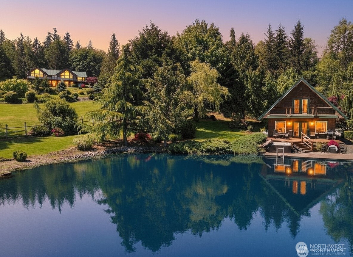 *New price* This amazing property is a hidden gem that must be seen to be appreciated! Set on 5.91 park-like acres with TWO remarkable PNW style homes, a private pond, and stunning Mt. Baker views, it offers the perfect blend of privacy, beauty, and income potential. Ideally located just 10 minutes from amenities in a highly sought-after area, the property feels like a private resort. The thoughtfully designed custom home captures gorgeous Mt Baker views and overlooks the serene landscape, while the cozy pondside cabin operates as a successful short term rental.    Meticulously maintained and tastefully updated, the main home features soaring vaulted ceilings, a dramatic entry, expansive windows, granite countertops, and inviting living spaces centered around a striking double-sided fireplace. Three bedrooms are conveniently located on the main level. Downstairs offers a second full kitchen, additional bedroom, bathroom, laundry area, and private entrance—ideal for multi-generational living, guests, or added rental income.    The charming 980 sqft cabin sits on the shore of a private trout-stocked pond where you or guests can relax, fish, swim, and enjoy watching the wildlife. Both homes offer expansive decks, private hot tubs, and beautiful views, creating the ultimate setting for relaxation and entertaining. A truly unique opportunity to own a versatile, primary living and income-producing estate in an unforgettable Pacific Northwest setting.