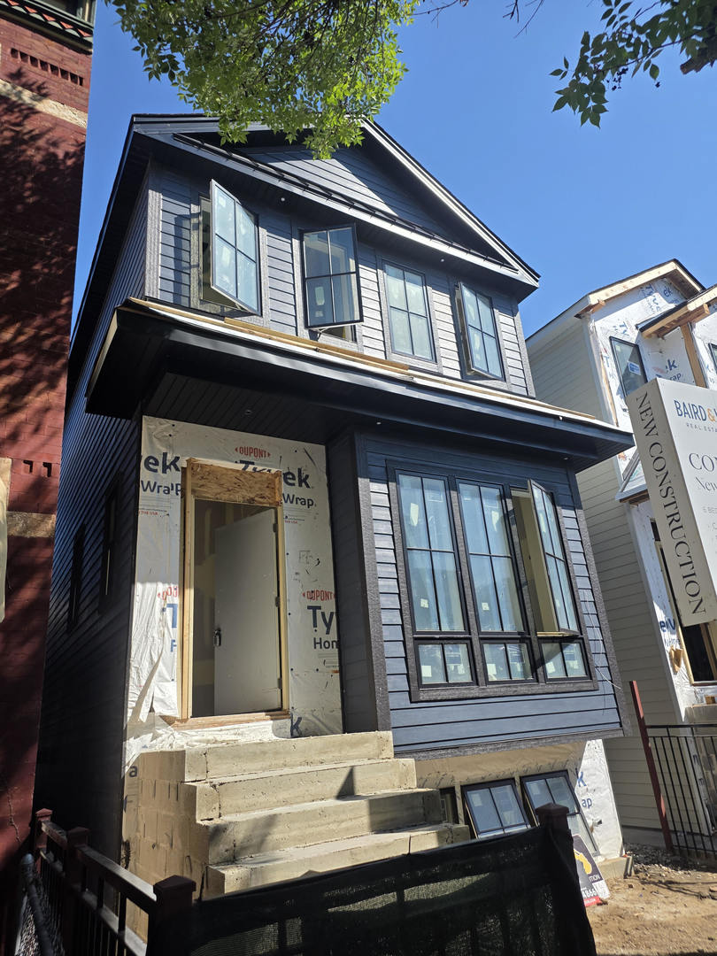 Stunning New Construction in West Town - Luxury Meets Livability  Welcome to your dream home in the heart of West Town! This newly constructed 6-bedroom, 4 full bath, 2 half bath residence blends timeless craftsmanship with modern amenities across three levels of meticulously designed living space.  Interior Highlights: Wide-plank 7" oak hardwood floors throughout, Two elegant indoor fireplaces plus a cozy outdoor fireplace for year-round ambiance, Custom cabinetry and millwork that elevate every room  Lower-level features: Two spacious bedrooms, Entertainment lounge with fully built-out media center, Private sauna in one-en-suite bedroom, Heated floors for ultimate comfort  Chef's Kitchen & Entertaining Spaces: Sub-Zero refrigerator, Wolfe 6-burner range with griddle, and two Bosch dishwashers, Oversized walnut island perfect for gatherings, Butler's pantry with prep sink and beverage center, Walk-in pantry for ample storage  Exterior Features: Heated limestone entry stairs with ice melt system, Expansive roof deck above the garage - ideal for entertaining or relaxing, Garage includes electric vehicle charging port  This home is a rare find, offering both sophistication and functionality in one of Chicago's most vibrant neighborhoods. Steps from top dining, shopping, and transit options, yet tucked away on a quiet residential street. photos are from previous development, occupancy estimated mid November