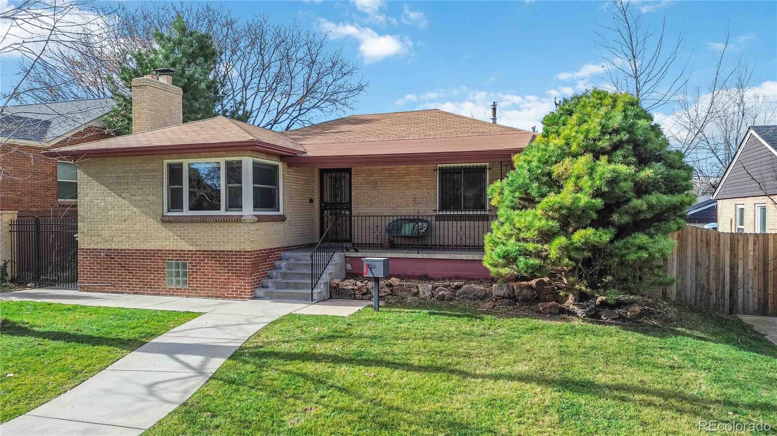 ***  OPEN HOUSE,  SATURDAY,  DECEMBER 20th,  11 AM - 1 PM  ***Beautifully maintained raised-ranch in the heart of Mayfair. Set on an oversized lot, this warm and welcoming home features a charming front sitting porch, gleaming hardwood floors and Anderson windows throughout. The main level offers a spacious living room with a cozy gas fireplace, a dining room with custom built-ins and kitchen with granite countertops. Two generous-sized bedrooms and an updated bathroom complete the main floor.The finished basement provides exceptional additional living space, including a large family room, two bedrooms with legal egress, a full bathroom and laundry room with additional storage. Enjoy Colorado’s outdoor living on the covered back porch and expansive patio—perfect for entertaining. An oversized detached 2-car garage adds convenience and extra storage.Unbeatable location with two neighborhood parks just steps away, numerous grocery options including Marczyk’s and Trader Joe’s and bus access only a couple blocks away (future BRT nearby). Minutes to Cherry Creek, downtown, and major highways. A wonderfully cared-for home in an ideal central Denver location.