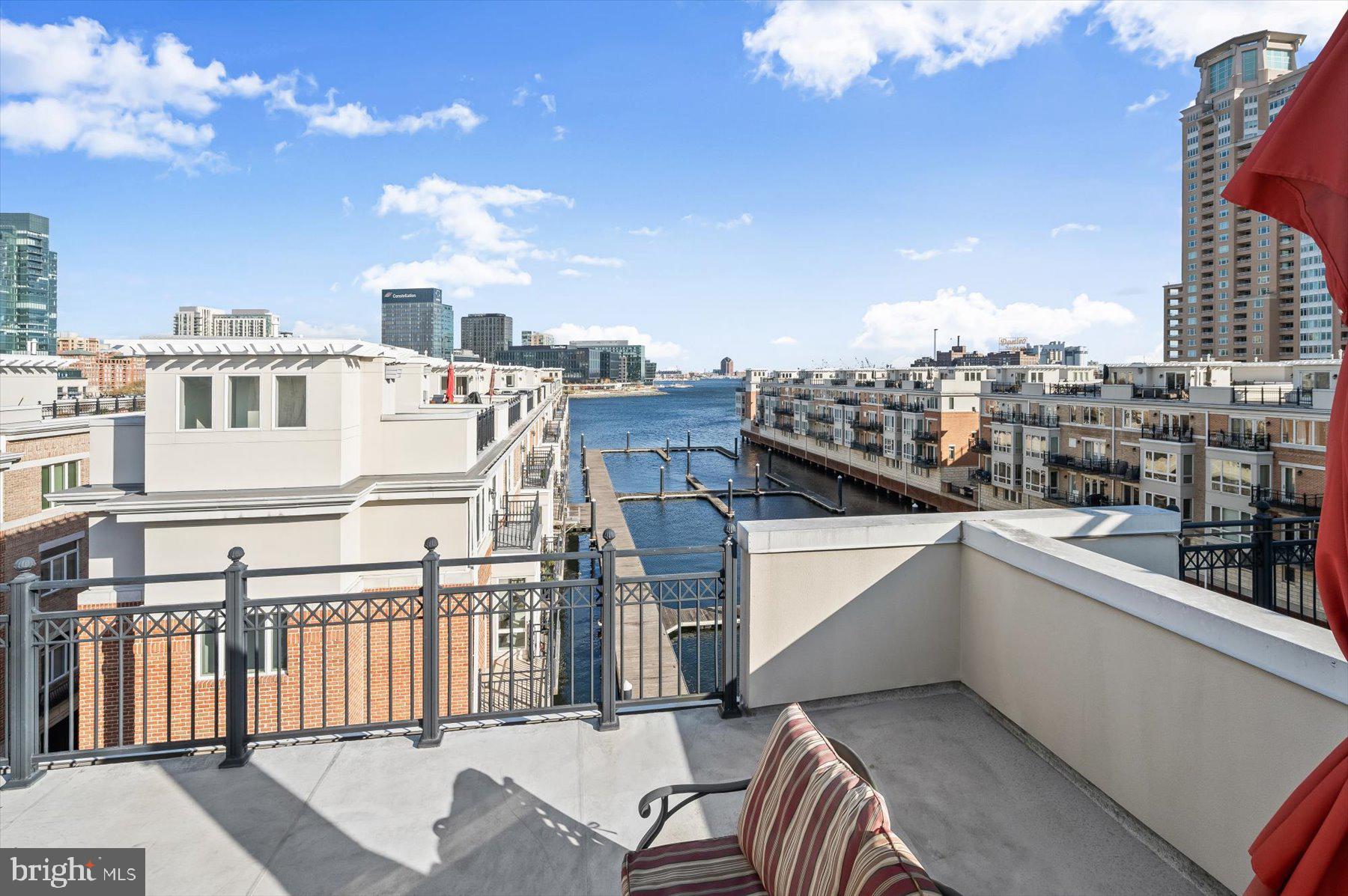 Pier Homes Living.  Experience The Difference.  Envision your new lifestyle at the distinguished The Pier Homes at Harborview.  This pristine condition, three bedroom corner residence with elevator features an impressive contemporary floor plan with 3,304 square feet of luxury living & amazing direct waterfront views from all five levels. The fourth level family room with wet bar offers fantastic versatility, easily converting into a formal third bedroom or private office.  Combined with 24/7 security and private on-demand security escorts this home provides one of the most luxurious & secure lifestyles offered in Baltimore.  **EXQUISITE FEATURES INCLUDE** Five level elevator, gas fireplace, hardwood flooring, renovated master bathroom, granite countertops, gourmet kitchen with stainless steel appliances, gas cooking, wall oven, wet bar, dedicated laundry room, garage storage closet, roof top terrace and new water heater (2025).  Parking for four vehicles is provided for within the attached two car garage and on the two car parking pad.  The level one rear patio area, three exterior balconies and spacious rooftop terrace provide ample outdoor entertaining space and panoramic city skyline & water views.  Community amenities include 24/7 security & on-demand security escorts, a private guest parking garage, outdoor pool, private fitness center, concierge services, private trash & snow removal, marina, Bellini’s dock bar, DiPasquale’s Italian deli & market, waterfront promenade walking/jogging/biking path and beautifully landscaped grounds.  A conveniently located water taxi can take you to explore any neighborhood in the city.  With countless shopping, dining and entertaining options just minutes away from this centrally located Inner Harbor property you can enjoy a lifestyle offered nowhere else in Baltimore.