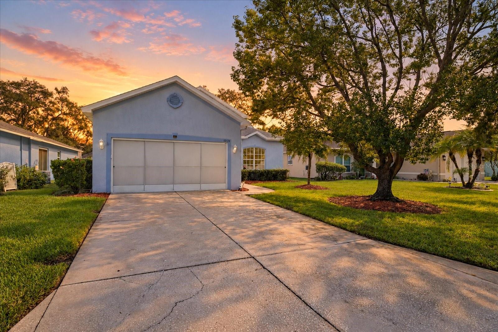 Virtually Staged. WOW—Priced to Sell! Welcome to Summertree!Come discover the relaxed Florida lifestyle you’ve been looking for in the desirable 55+ community of Summertree! This well-maintained 2-bedroom, 2-bathroom, 2-car garage home offers approximately 1,644 square feet of comfortable living space and is ready for you to make it your own.The spacious kitchen provides plenty of cabinet and storage space, while the convenient indoor laundry room adds to the home’s functionality. Recent updates include a newer roof and newer HVAC system, giving you added peace of mind.And then there’s the lifestyle! Summertree offers an incredible array of amenities designed for recreation, relaxation, and socializing. Residents can enjoy a private clubhouse and pool, as well as a community center featuring a pool, jacuzzi, billiards room, library, game room, and fitness center. Outdoor activities include golf, shuffleboard, tennis and pickle ball—there’s truly something for everyone!The HOA fee includes cable, internet, trash pickup, and grounds maintenance, making everyday living even easier. This home is turnkey—all you have to do is move in, relax, and enjoy the Florida lifestyle!Conveniently located just off Route 52, you’ll be close to shopping, restaurants, and excellent medical services. Plus, with easy access to the Suncoast Parkway, Tampa is approximately 35 minutes away.Homes in Summertree are highly desirable.  Don’t miss your opportunity to see this beautiful home and experience everything this wonderful community has to offer!Schedule your private showing today—this one is worth seeing!