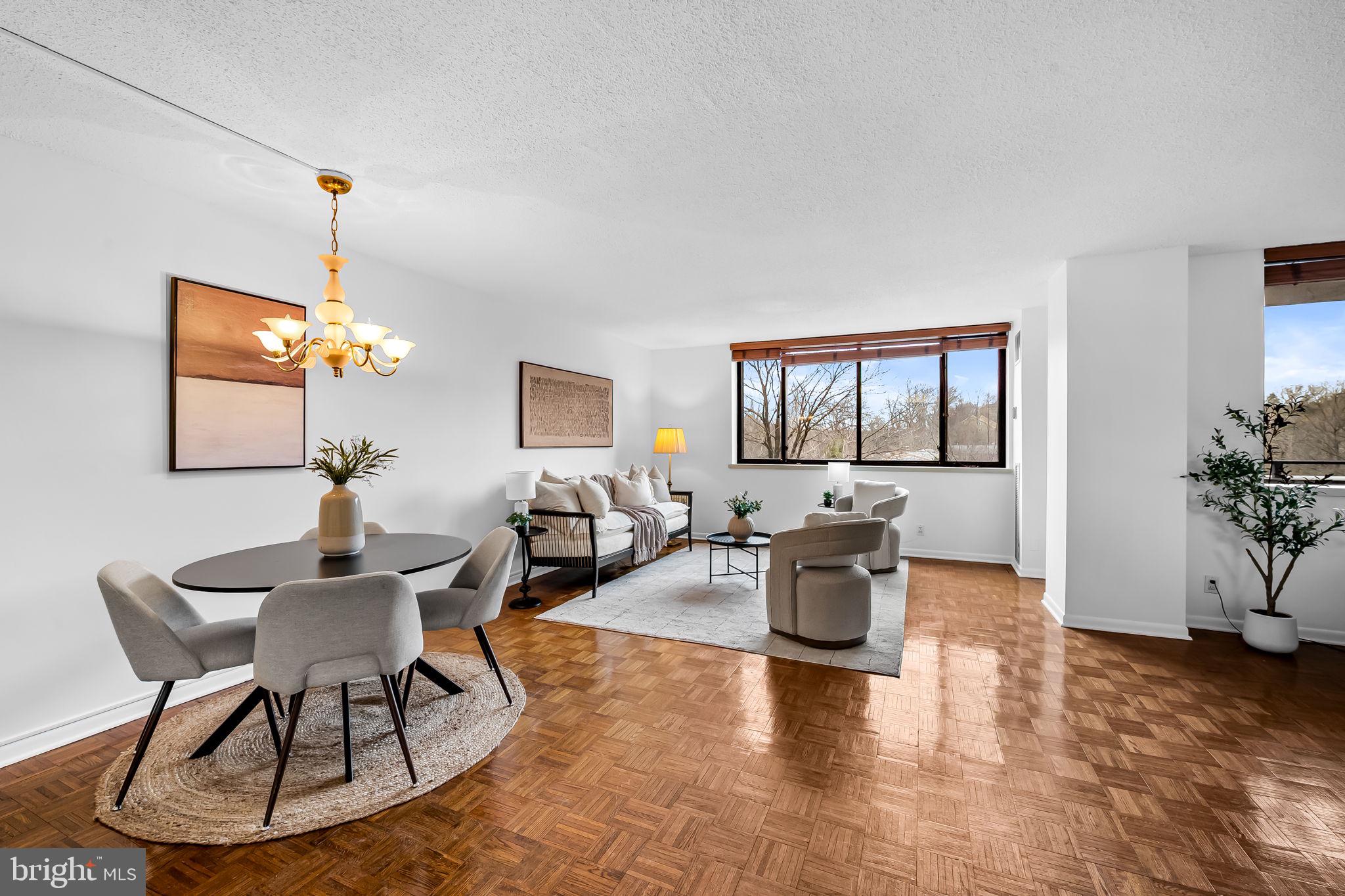 Freshly painted 1 bedroom 1 ½ bath condo in the highly desirable Harper House – Cross Keys’ luxury high-rise building offering secure, care-free living with the support of a 24/7 doorman and front desk attendant. This open concept floor plan features a kitchen with stainless steel appliances & tile floor, a combined living room/dining room, plus a bonus space perfect for a home office area or den. Just off the living area you’ll find a lovely north-facing balcony – accessible from both the living room and the bedroom – overlooking an expanse of mature trees and the nearby pool and village clubhouse. A spacious primary bedroom – accessed via a separate hall with large double closet -- features an en suite bathroom and dressing area/closet space. A convenient half bath in the entry hall - perfect for guests - contains the in-unit stackable washer and dryer.Condo fees include electricity, water, a designated garage parking space & storage unit. Residents enjoy access to a host of amenities, including three community pools and a clubhouse, ideal for social gatherings or relaxation. The Village of Cross Keys is not just a location, it's a lifestyle that includes a lively community hub complete with an array of shops, delightful restaurants and cafes, all just a short stroll away. A short distance from I-83 with easy access to both northern and southern destinations, this is an excellent location for commuting or exploring Baltimore’s cultural scene.