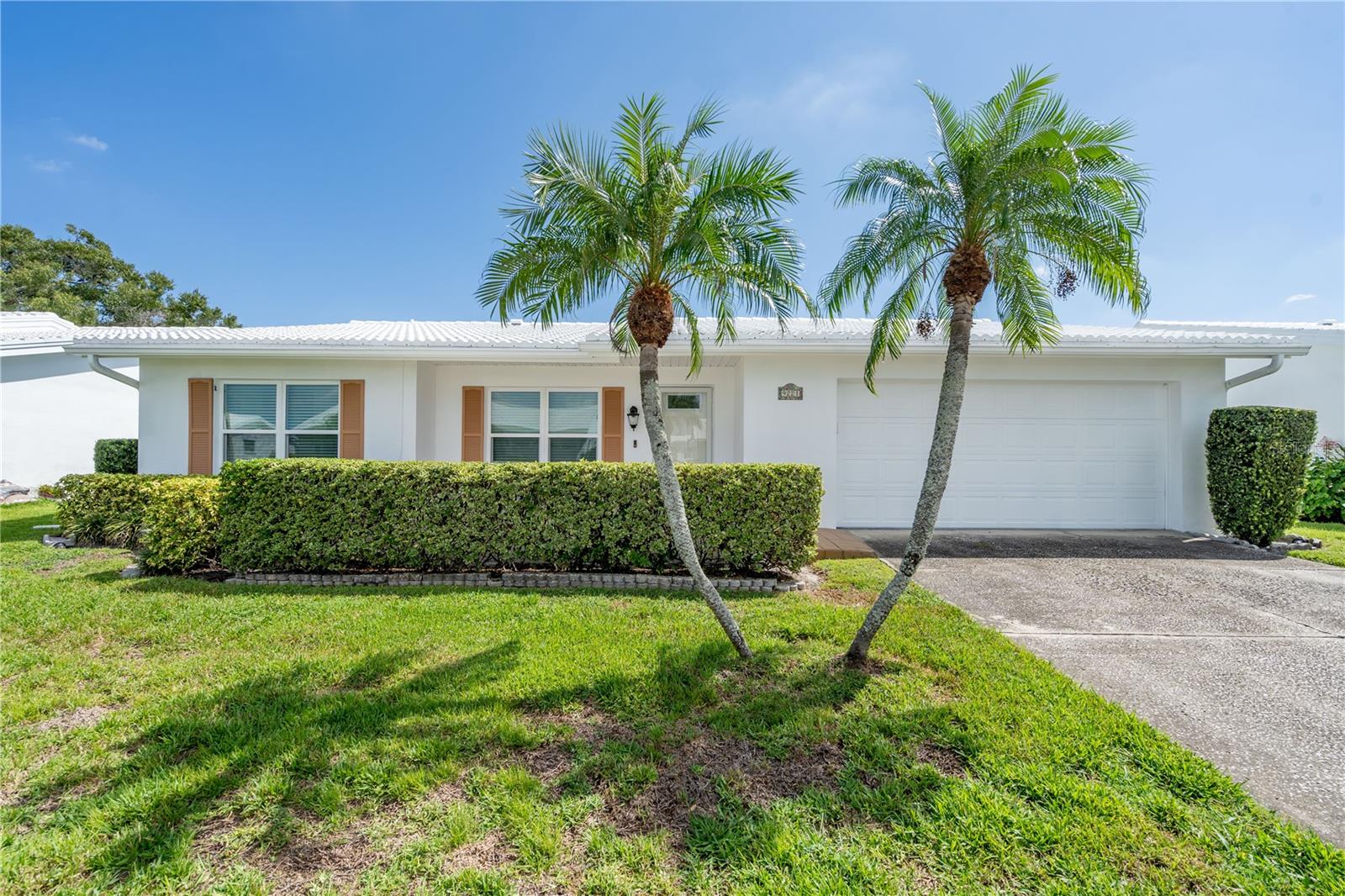 You have found your next home.  This 1796 sqft 2 bedroom, 2 bath, 2 car garage Philodendron split floor plan, waterfront home, with spectacular views is ready and waiting for you to call it home.  With newer luxury vinyl plank flooring, 2022, new electric panel, new kitchen appliances 2023, new quartz counters 2022, new carpeting in both bedrooms, 2025, new hurricane impact windows and front door 2020.   All this and more in Mainlands of Tamarac by the Gulf  where the monthly maintenance fee of $342.89 includes lawn care/irrigation maintenance, exterior painting/power washing, water/sewer/trash, internet/cable in addition to maintaining all community property (clubhouse, pool, roads, sidewalks, lakes)!  Take advantage of heated in-ground pool, shuffleboard courts, public golf course and so many other activities ensuring that you will always have something to do in one of Pinellas County's most sought after 55+ community.  Not expecting this one to last long.
