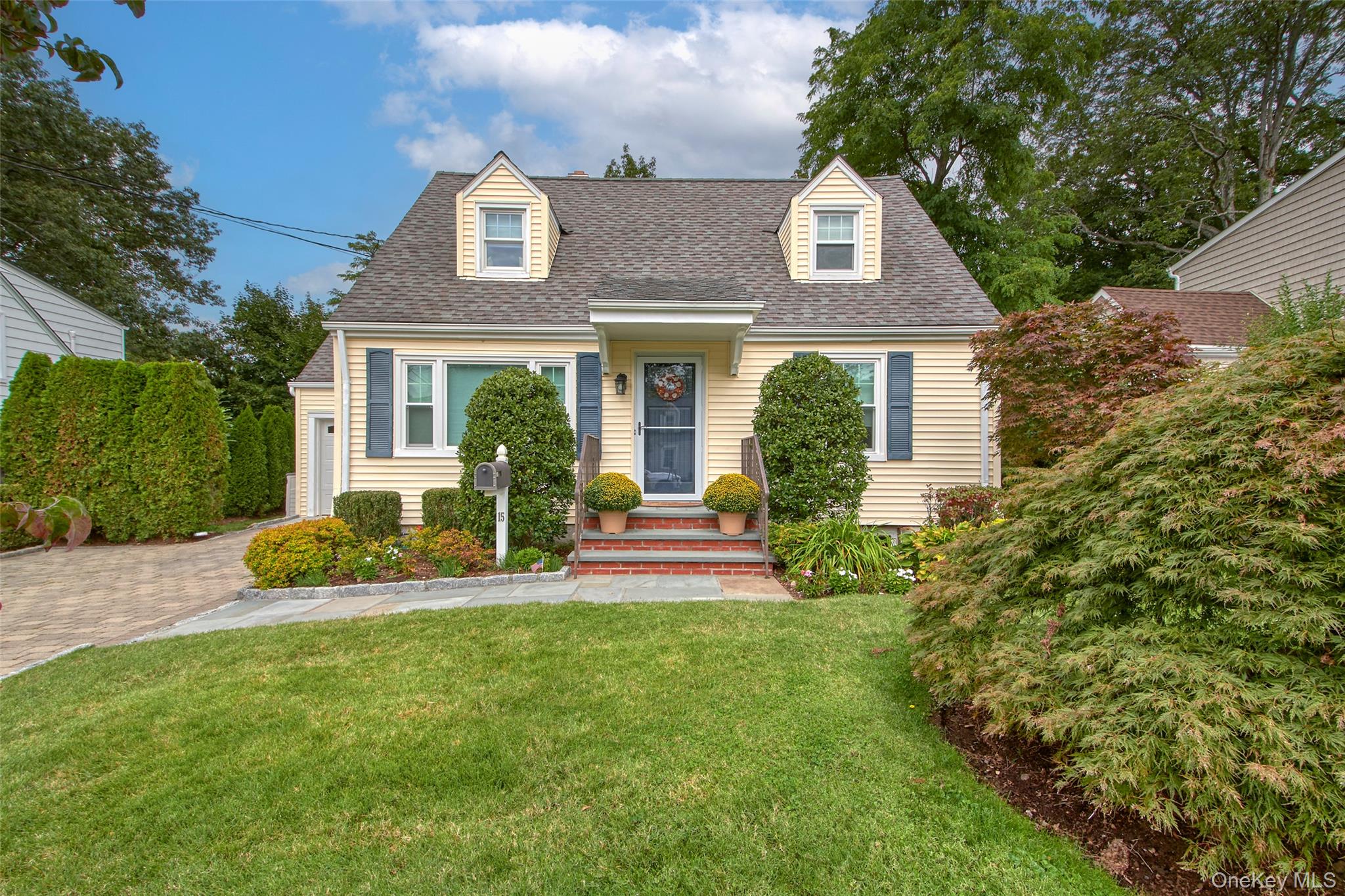 Come see this fabulous Cape Cod in Rye Brook. Look no further for a beautiful maintained home situated on a tree lined street with level property. Hardwood floors throughout, updated eat-in-kitchen, 2 updated baths and a fabulous finished space in the playroom with a fireplace. The outdoors allows for entertaining on a nice size patio with a wonderful back yard. Taxes and Sq Ft per town records. Taxes do not include STAR deduction. Attached is a one car garage with driveway parking too.