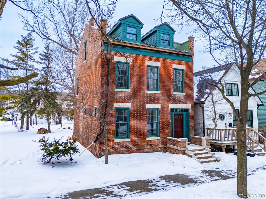 One of Detroit’s oldest surviving brick homes, this extraordinary three-story 1856 Federal-style townhouse stands in the heart of Corktown, Detroit’s oldest neighborhood.Built before the Civil War by Ireland-born mason William Murphy, the home reflects the Federal-style architecture more commonly associated with historic East Coast cities such as Philadelphia and Boston. Over the decades, it has embodied Detroit’s rich immigration story, including residence by Mexican immigrants during the Great Depression, one of whom is believed to have been depicted in Diego Rivera’s famed Detroit Industry Murals at the Detroit Institute of Arts.Now undergoing an extensive, no-expense-spared renovation by Detroit-based Integrity Building Group, this 1,800-square-foot residence blends historic preservation with modern performance. Original features including the brick masonry, select wood beams, and mahogany stairway railing remain intact, while all major systems, mechanical, electrical, and plumbing, are being replaced to deliver the comfort and reliability of new construction within a 19th-century shell.The main level offers a spacious living room with natural fireplace, formal dining room, and kitchen with pantry. The second floor features two bedrooms and a full bath. The third-floor former attic, which required significant restoration following evidence of a historic fire, has been reimagined with added dormer windows to bring in natural light and presented a perfect opportunity to add a primary suite and full primary bath.Located just blocks from Michigan Central Station and surrounded by ongoing investment and development, this home offers a rare chance to steward a defining piece of Detroit history while enjoying the benefits of a complete renovation.An exceptional offering for those seeking architectural significance, modern infrastructure, and a place within one of the city’s most desirable neighborhoods.