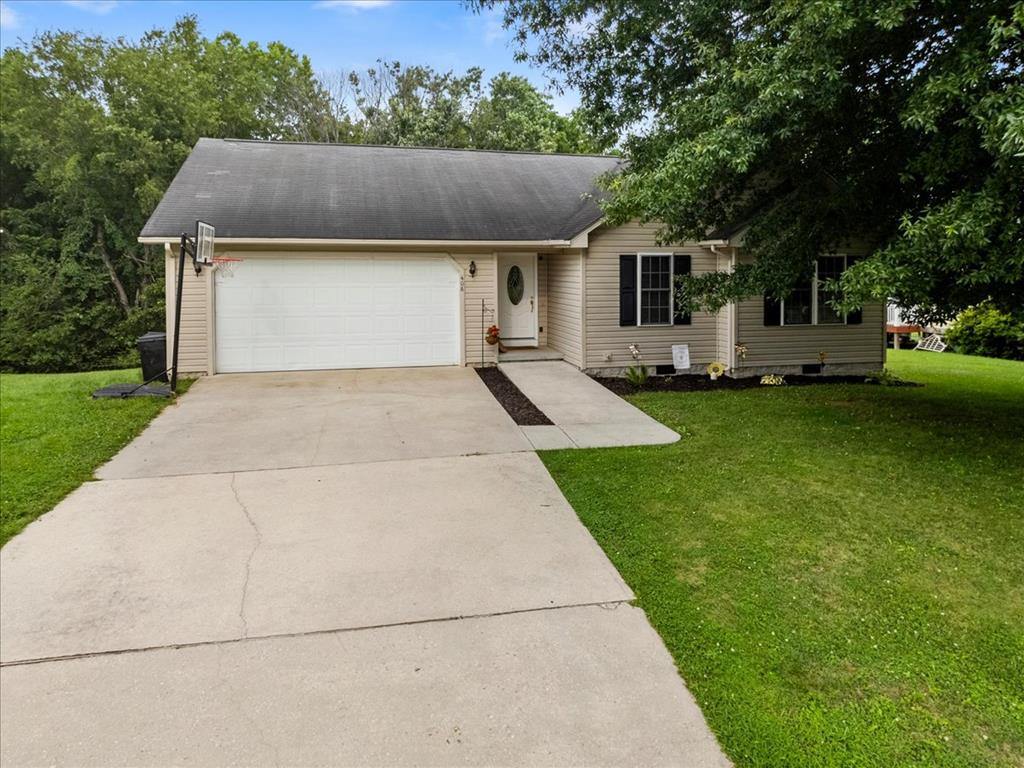 Welcome to the perfect place to begin your next chapter! Whether you are buying your first home, simplifying into easy one-level living, or searching for a low-maintenance property in a convenient location, this inviting ranch offers the comfort, space, and lifestyle you have been looking for. Nestled on a lovely 0.34-acre lot in the heart of Dublin, this home provides peaceful outdoor living with a tree-lined backyard while remaining just minutes from shopping, dining, schools, and everyday conveniences. A wide concrete driveway leads to the attached two-car garage, offering plenty of parking, storage, and room for hobbies or weekend projects. Step inside and feel instantly at home as the welcoming foyer opens into a bright, inviting living room filled with natural light and centered around a cozy gas log fireplace. Whether hosting family for the holidays, cheering on your favorite team, or enjoying a quiet evening at home, this comfortable gathering space is designed for making memories. The seamless flow into the dining area creates an open, connected feel perfect for everyday living and entertaining. Just beyond, the kitchen offers abundant cabinetry, generous countertop space, and an efficient layout for everything from quick meals to weekend baking. A spacious pantry keeps everything organized, while the adjoining laundry room with direct garage access adds convenience to your daily routine. Step outside onto the rear deck and enjoy your own private retreat overlooking the tree-lined backyard—perfect for morning coffee, summer grilling, gardening, pets, or simply relaxing outdoors. The primary suite offers a peaceful escape with a private bath and walk-in closet, while two additional bedrooms provide flexibility for family, guests, a home office, or hobbies and share a second full bath nearby. With its desirable one-level floor plan, attached two-car garage, and convenient Dublin location, this charming ranch offers the perfect blend of comfort, practicality,