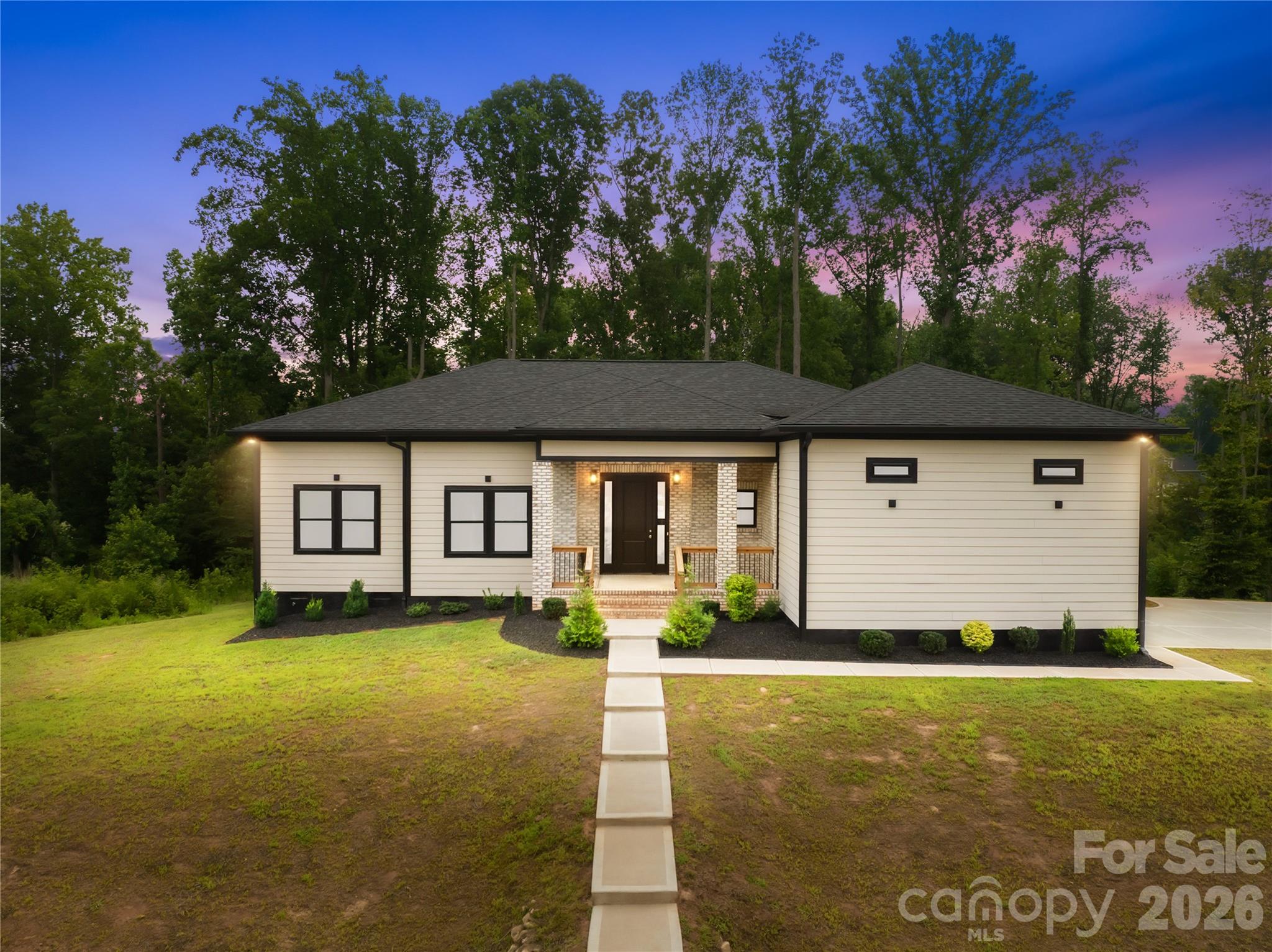 Welcome home to this beautifully crafted 2024-built ranch in the sought-after Bennington Estates subdivision! Situated on a full acre, this 4-bedroom, 2.5-bath single-story home offers 2,002 square feet of thoughtfully designed living space. The open main level features a spacious primary bedroom, three additional bedrooms, and a bright living room that flows seamlessly into the kitchen. The kitchen is equipped with modern appliances including an induction cooktop, electric oven, dishwasher, and pot filler for convenience , complemented by durable tile and vinyl plank flooring throughout. A dedicated main-level laundry room adds everyday convenience.Step outside to enjoy the covered front porch and deck, ideal for relaxing or entertaining. The attached 2-car side-entry garage offers 470 square feet of storage and parking, accessed via a concrete driveway. Built with quality craftsmanship, the home features a partial brick and fiber cement exterior and an architectural shingle roof.Don't miss this opportunity to own a new home in Bennington Estates!