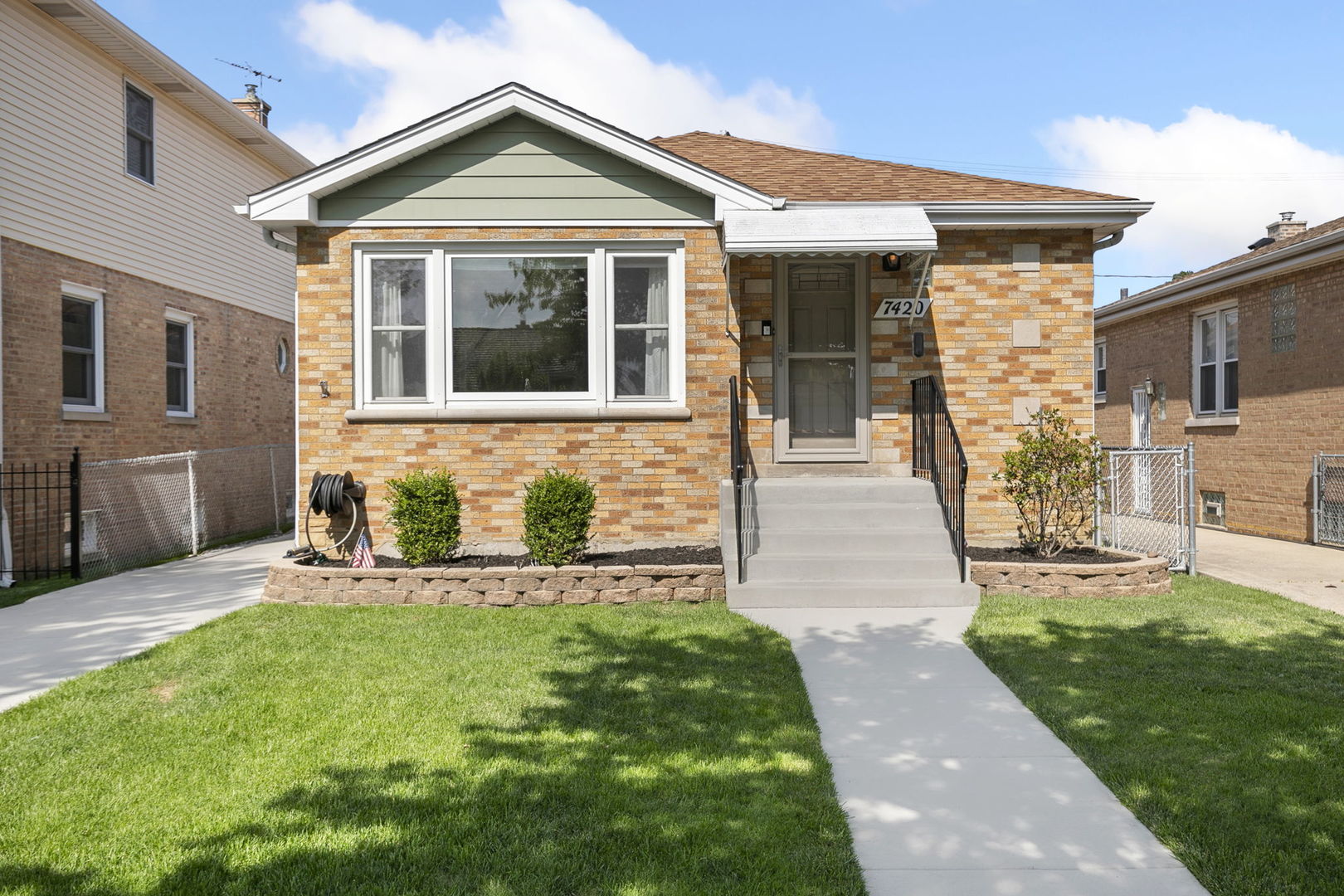 Welcome to 7420 N Octavia Ave, a beautifully renovated raised ranch offering modern updates and classic charm in one of Chicago's most desirable neighborhoods. Sitting on a wide 36' x 125' lot, this home features dusk cherry luxury vinyl plank flooring throughout and generous ceiling height making for a spacious, airy feel. The sunlit living room is highlighted by oversized bay windows with east and southern exposure, while all three bedrooms are generously sized-two with peaceful northern light and the primary with both north and west-facing windows. The main bathroom has been fully remodeled with a new tub, updated electric and plumbing, stylish fixtures, and proper exterior ventilation. The gourmet kitchen is a true centerpiece, showcasing quartz countertops, two-tone Malmo Suite cabinetry, a five-burner gas range with a vented hood, built-in oven and microwave, a farmhouse sink, and a triple-door refrigerator/freezer-all new in 2025. The basement offers 7-foot ceilings, wood shelving, and a second refrigerator (included), with plenty of room for storage or future expansion. Key updates include a new roof (2016), all windows and doors (2019), a professionally sealed foundation by Perma-Seal in 2023 with a transferable lifetime warranty, a 2008 furnace and A/C system, a 2010 water heater (plus a brand-new uninstalled unit that conveys), and a new washer/dryer in 2025. Outside, enjoy a concrete driveway, front porch, a two-car garage with shelving, fresh mulch, a brick patio, and an extended driveway-ideal for entertaining or relaxing. This home is located within the Chicago Public School District and is assigned to top-rated Ebinger Elementary School (K-8), just 0.8 miles away, and Taft High School (7-12), located 2.4 miles from the home. Situated in the heart of Edison Park, this northwest side neighborhood is known for its tight-knit community, excellent schools, and vibrant local scene. Enjoy dining along the popular "Restaurant Row," browsing charming shops, and participating in local events like the annual Edison Park Fest-all while enjoying the ease of suburban living with quick access to downtown via nearby Metra stations. Additionally, there are many varied grocery store options nearby - Trader Joe's, Jerry's Fruit & Garden and H Mart.
