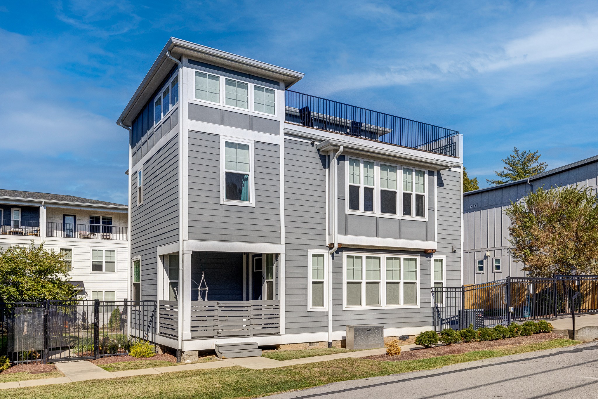 Wake up to skyline vibes and lock-and-go living just minutes from downtown. This modern, chic home delivers the city lifestyle you want with the everyday comforts you need—think clean lines, airy living spaces, and a rooftop lounge made for golden-hour hangs and weekend entertaining with scenic views. The thoughtful layout features three bedrooms, including a retreat-worthy primary suite on the second level; the laundry room is conveniently on the same floor to keep daily routines easy.
A controlled, keypad-access entry and gated setting add everyday convenience—secure package drop-offs, simple guest access, and a little extra privacy—while keeping you close to everything. A non-assigned parking spot comes with the property, too!
When it’s time to get out, you’re in a prime spot for great eats, craft drinks, and outdoor time. Grab tacos at Redheaded Stranger, book a table at chef-driven FOLK, or meet friends for a pint at East Nashville Beer Works. For playtime, Topgolf is a quick hop, and the riverfront Monday Night Preservation Co. taproom is another favorite nearby. Green space is close, too—Cleveland Park’s community center and seasonal pool, plus McFerrin Park, Tom Joy Park, and Oakwood Park for walks, workouts, and pickup games.
Smart, stylish, and city-close—this is the move. (Note: all furnishings are negotiable for purchase, too!)