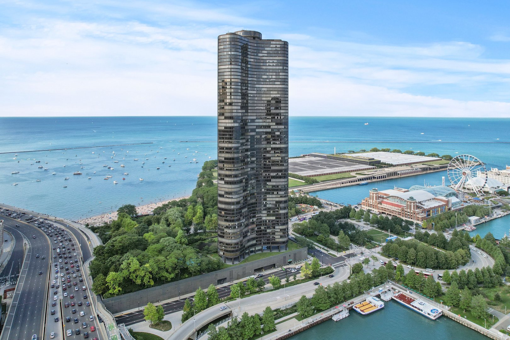 Luxury 52nd-Floor Condo with Iconic Views at Lake Point Tower. Experience unmatched luxury living in this stunning 3-bedroom, 2-bath residence at 505 N Lake Shore Drive, just steps from Navy Pier. Soaring high above the city, every room offers sweeping views of Lake Michigan, the Chicago skyline, and seasonal fireworks. Designed with a custom open floor plan, this home features abundant built-in storage and elegant cabinetry throughout. The chef's kitchen is an entertainer's dream, showcasing quartz countertops, premium appliances, custom cabinetry, a dry bar, and a large island overlooking the lake. The expansive primary suite includes custom built-ins, a spa-inspired bath with oversized rainfall shower, dual vanity, and sleek finishes. The spacious second bedroom and equally refined second bath provide comfort for guests, while the third bedroom-currently a sitting room-can easily be enclosed for additional bedroom. An in-unit washer and dryer complete the home. Leased parking is available within the building. Lake Point Tower residents enjoy world-class amenities: indoor and outdoor pools, state-of-the-art fitness center, private 2.5-acre park, conference rooms, convenience store, dog run, private theater, 24-hour door staff, and a beautifully landscaped sundeck. Located in the heart of the city, this premier address offers seamless access to the Magnificent Mile, lakefront paths, dining, shopping, cultural attractions, and public transportation. Don't miss the opportunity to own this extraordinary piece of Chicago luxury. Take a 3D tour-click the 3D button and walk through today!