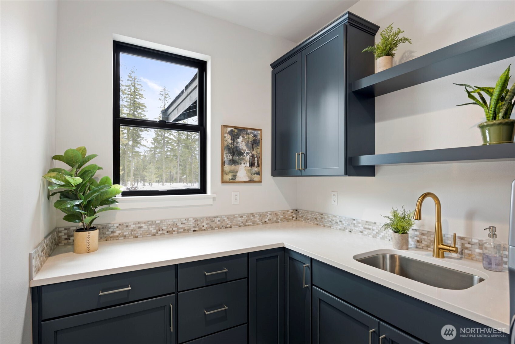 A spacious laundry room offers exceptional storage and plenty of room to keep all your extra household items, gear, and everyday essentials organized and tucked away.