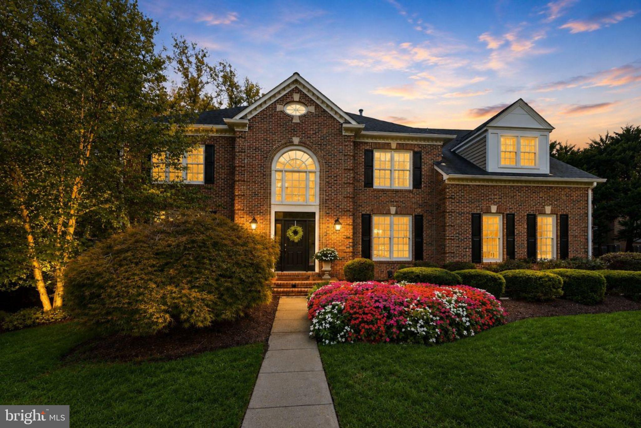 **Open House Sat & Sun** This is a truly exceptional home, filled with the quality, craftsmanship and extra details you expect in a home at this level. Beautiful hardwood floors run throughout, the rooms are spacious and comfortable, and the home sits on an incredibly private, level homesite surrounded by mature landscaping at the end of a quiet cul de sac.The main level is designed for the way you actually live. The formal living room is warm and inviting with its own gas fireplace, creating a comfortable place to entertain, sit with friends or settle in with a good book. Across the home, the family room makes an entirely different statement with a soaring two story ceiling, walls of windows and a dramatic floor to ceiling stone wood burning fireplace. A private office with bay windows, formal dining room, powder room and laundry room round out the main level.At the center of it all is a fantastic designer kitchen. A huge island provides plenty of room to gather, surrounded by custom cabinetry, granite countertops, Viking appliances and Sub Zero refrigeration. Additional touches include filtered and instant hot water, a sensor faucet and a spacious breakfast area filled with natural light.Just outside, the large deck becomes an extension of the living space. It overlooks a completely level backyard surrounded by mature landscaping and trees, giving you a level of privacy that is increasingly hard to find. There is plenty of room to entertain, relax or enjoy a fire in the wood burning chimney on a cool evening. A covered patio below provides another outdoor living area with direct access from the walkout lower level.With 6 bedrooms, 5 full baths and 2 half baths, there is no shortage of space. The primary suite includes a separate sitting area, two dressing areas, generous closets and storage, and a marble bath with a large shower and separate water closets. Three additional bedrooms and two full baths are also upstairs, including a Jack and Jill bath.The walkout lower level feels like a true continuation of the home rather than an afterthought. There are two additional bedrooms, two full baths, a large recreation room with a gas fireplace, fitness space, a half bath, cedar wine cellar and substantial storage. It is an ideal setup for guests, extended family, entertaining or simply having room for everyone to spread out.A side load two car garage adds to the classic exterior and keeps the front elevation clean. The mature landscaping and private setting make the property feel removed from the activity around it, yet Reston Town Center is approximately 2 miles away. Dulles International Airport, Metro, restaurants, shopping, lakes, trails, pools and tennis are all within easy reach.This is a home that delivers on the details, but what really stands out is how comfortable it feels. Impressive when you want it to be, private when you need it to be, and designed with spaces you will actually use.
