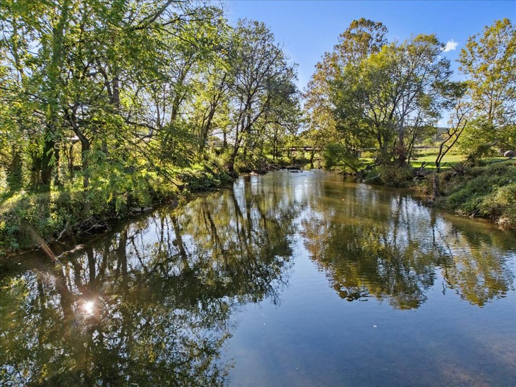 Located in the scenic countryside of Speedwell, VA, this 2.5-acre property offers 145 feet of beautiful creek frontage and endless possibilities for outdoor enthusiasts. While it may possibly not be suitable for building, it provides a fantastic opportunity for a campground or rental campsites, where visitors can enjoy the peaceful setting, fishing, and nearby horse trails. There are no zoning restrictions in the county, but buyers are encouraged to verify any potential use with the local authorities. The creek is known for excellent fishing, with the potential for trophy-sized trout, making it a prime spot for families, nature lovers, and equestrians looking for a weekend getaway. Whether you're looking to create an income-producing retreat or simply enjoy the great outdoors, this unique property is ready to fulfill your vision!