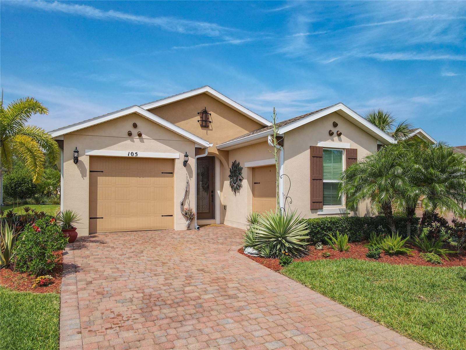Welcome Home to this Lovely Bergamo Model Home in the Vestrella Neighborhood of Soliviita, on a lot surrounded by open spaces, trees and the beauty of Central Florida. This home is well maintained and ready for a new owner. The Lanai has a Peaked Roof and is screened offering a space to enjoy the outdoors plus a pavered patio for grilling. The public areas of this home have crown moulding and tile laid in a brickwork pattern with carpeting in the bedrooms, 8' Doors and Windows, Tall Cabinetry, Granite Counters and Upgraded Tropical Landscape. The Exterior was painted in 2024. The floorplan is beautifully designed, modern and open with a great use of space. 2 Bedrooms, 2 Baths, Study, Great Room, Dining Room and Kitchen. As you enter the home the Den with trey ceiling is on the right and gives you the option to use this as an additional bedroom, if needed. The Kitchen is well appointed with bisque cabinets, granite counters, stainless appliances and pendant lights above the island. The generous Primary Suite has carpeting and a trey ceiling and is at the back of the house with privacy provided by all the tropical landscaping. The Ensuite Bath is large with dual vanities, tall cabinets with drawers for storage, a walk-in tiled shower, and large custom closet. This home has a One Car Garage PLUS a separate Golf Cart Garage with additional space for storage or a workshop.Solivia is a 55 PLUS ACTIVE community…Swim in any of 14 temperature controlled pools, work out in 2 State of the Art Fitness Centers with the latest equipment, trainers and a range of classes. Play Golf on 2 18 Hole Championship PGA Courses, Drive Balls, Practice Putting, Play tennis, pickleball, softball, bocce ball or horseshoes. Take a walk in our beautifully landscaped community or visit our Village Center with Stonegate Grille or Mosaics Restaurant, enjoy entertainment, take a class at Solivita University, shoot pool, visit our lending library, shop in our pro shop, have a slice at the Bistro, garden in the community garden, or take your dog to the dog park. The HOA covers your landscaping and irrigation, security, tv and internet. Across the street from the main entrance are a hospital and medical center, Poinciana Plaza Shopping Center featuring TJMAXX, RackRoom Shoes, Ulta Beauty, PETCO, Hand and Stone Massage, Ross, Panda Express, Outback Steakhouse and more. Solivita is a great place to call home and enjoy life to the fullest!