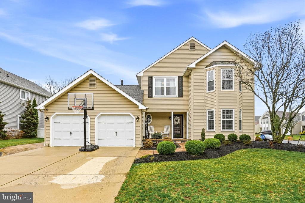 Welcome to this beautiful home in the desirable Stone Mill Estates community! This well-maintained 3-bedroom, 2.5-bath home offers great curb appeal with professional landscaping, a charming front porch, and a spacious driveway leading to a 2-car garage. Step inside to a welcoming foyer that opens to a bright living room and formal dining room—perfect for everyday living and entertaining. The main level also features a cozy family room with direct access to an EP Henry paver patio and a fully fenced backyard, ideal for outdoor gatherings. The eat-in kitchen is equipped with granite countertops, stainless steel appliances, updated cabinetry, tile backsplash, and newer flooring. A convenient powder room and laundry area—complete with a custom built-in storage system—finish the main level. Upstairs, the primary suite offers a private retreat with a walk-in closet featuring a custom organization system and an updated ensuite bath with a stall shower and garden tub. Two additional generously sized bedrooms and a remodeled full hall bath complete the upper level. This home has been thoughtfully updated over the years, including newer HVAC (2022), hot water heater (2021), garage doors (2021), fencing (2021), washer and dryer (2021), kitchen refrigerator (2023), dishwasher (2019), and numerous interior and exterior improvements. Additional highlights include updated bathrooms, newer carpeting, interior painting (2026), paver walkway and porch (2023), outdoor lighting, and more. Uninstalled flooring (purchased in 2024) is also included. Located in a welcoming community with award-winning schools, this home is conveniently close to shopping, golf courses, and parks. A perfect blend of comfort, updates, and location—don’t miss this opportunity!