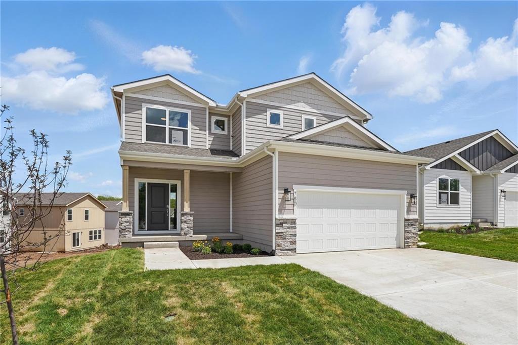 Just Completed & ready for fast close! Welcome to this inviting 4 bed, 2.5 bath two-story Serenity with a thoughtfully designed floor plan in one of the most exciting communities in the Kansas City area. The main level features a spacious open concept ideal for both everyday living, social connection and entertaining.  The wealth of main level windows look out onto wide open green space and the low maintenance deck provides a haven to the outdoors.  Workspace and storage abound in the beautifully coordinated kitchen and the convenient drop zone and half bath ensure that there's a place to shrug off the days gear or do that one final check in the mirror before heading out. Upstairs, all bedrooms offer comfort and privacy, complemented by the convenience of an upstairs laundry room. This home combines practicality with modern living, making it a must-see for those seeking both functionality and style. The full unfinished lower level presents endless possibilities—create your dream space or use for extra storage. Eastbrooke at Creekmoor has it all!  Designed around 108 acre Lake Creekmoor and the acclaimed 18 Hole Championship Golf Course, Creekmoor offers one of the most comprehensive residential amenities packages available, where homeowners with both active and relaxed lifestyles enjoy what feels like vacation all year long.  Pools, tennis, pickleball, basketball, 24-hour fitness center, golf pro shop, Tavern on the Moor restaurant and bar, fishing, boating, SUP, and still more...it's ALL here!  With an abundance of shops, restaurants and services minutes away and with easy access to Jackson and Johnson Counties, homeowners have all the benefits of metro living at their fingertips while enjoying home life outside the hustle and bustle. Whether making your first home purchase or your last, this is a destination community like no other.  Please follow directions in listing as streets are still new.