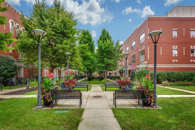 Luxury and comfort converge in this stunning, recently remodeled 3-bed, 3-bath end-unit townhome, ideally located where Ravenswood, Andersonville, and Uptown meet. This sophisticated home offers a private rooftop deck, attached 2-car garage, and an additional exterior parking space. Set in the gated, beautifully landscaped Greenview on the Park community, this residence enjoys one of the most desirable and quiet locations in the complex, with gated rear access to both the garage and exterior parking spot, plus one of five guest parking spaces right next to the home; perfect for when guests visit. A private gated front yard, professionally landscaped (with potential to convert to grass), adds charm and outdoor space. Inside, thoughtful upgrades abound. The first floor is fully renovated, featuring a family/media room, coat closet with storage under the stairs, a third bedroom, heated tile floors throughout, and a spa-like bathroom with rain shower. The oversized attached garage includes shelving for storage with space for bikes and seasonal gear. The second level offers expansive, sun-filled living, kitchen, and dining areas with 9' ceilings, hardwood floors, custom drapery, and a cozy gas fireplace. The open kitchen is a chef's dream: quartz countertops, soft-close cabinetry with pull-outs, drawer microwave, touchless faucet, pantry, LED under-cabinet lighting, and a bar-height counter for four. Step out to the spacious deck to grill; perfect for al fresco dining. On the third floor, two large bedrooms each offer walk-in closets and ensuite bathrooms. The luxurious primary suite includes dual vanities, a walk-in shower, and a linen closet. The 4th level boasts an additional storage space plus a private rooftop deck (new in 2021) with sweeping views-an ideal retreat for morning coffee or viewing the sunset. A new roof (2020) beneath adds long-term peace of mind.  With north, south, and east exposures, oversized windows, and 9' ceilings on the main levels, natural light fills every corner. Smart-home features include central vacuum, a Honeywell programmable thermostat, and Xfinity security system with cameras. Walk to parks, cafes, top-rated schools, and transit. Zoned for Ravenswood Elementary and within walking distance to Lycee Francais, German International School, Rogers Park Montessori, Chicago Waldorf School and several excellent daycare centers. Easy access to the Brown, Red, and Purple Lines, the Ravenswood Metra, 90/94 and Lake Shore Drive. This move-in ready home offers elegant finishes, abundant space, and unbeatable convenience-a perfect fit for those who want luxury living in a vibrant neighborhood. Well-run HOA; only 10% of units may be rented (currently none are).