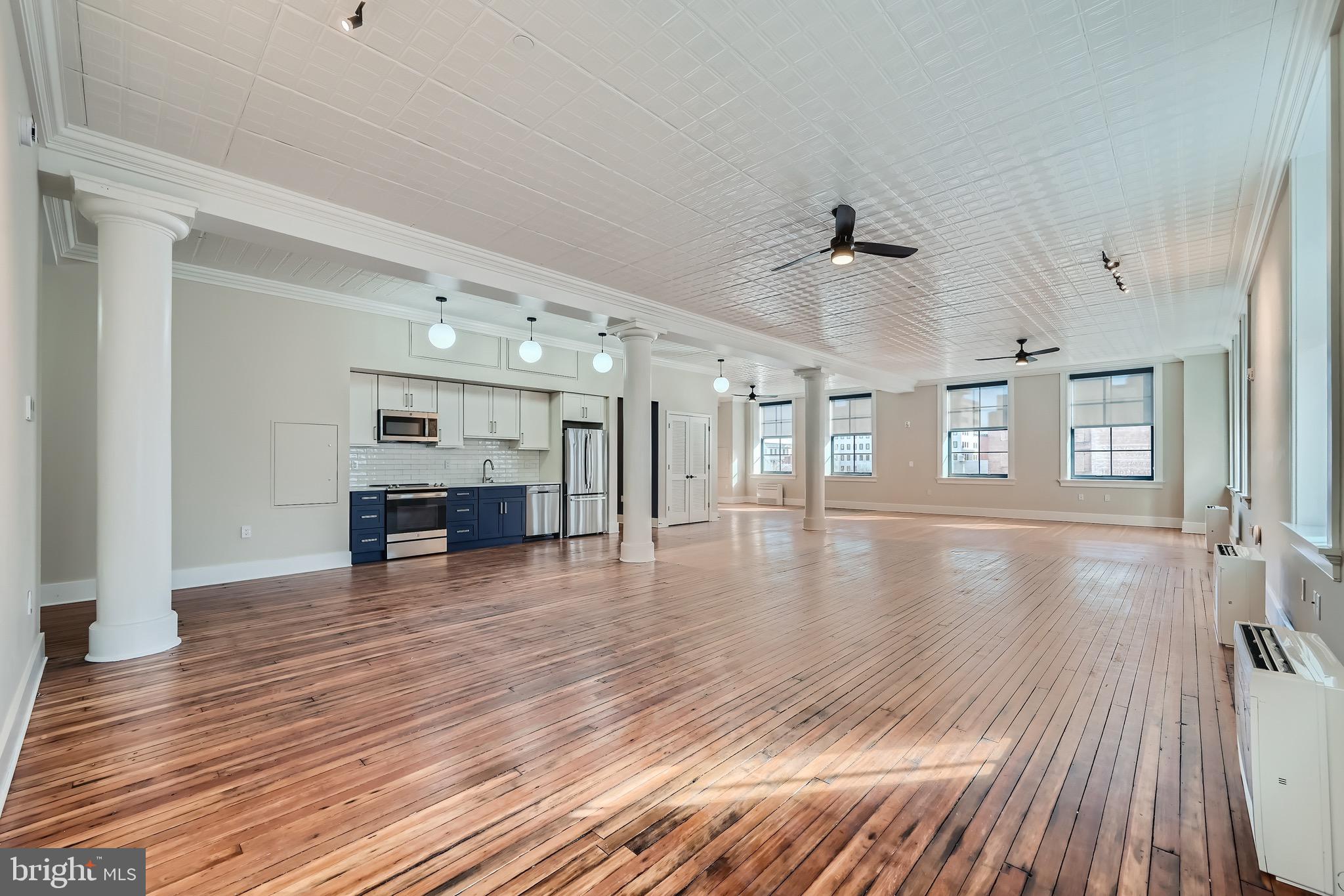 Unlike any other apartments in Baltimore!  Newly renovated Open Live/Work lofts.  If you are looking for expansive space – and something historically special – you owe it to yourself to visit the Crook Horner Lofts before you rent anywhere else. Located at the corner of North Howard and West Saratoga, the Crook Horner Lofts will bring 15 units of expansive open loft apartments to downtown Baltimore along with two lively street-level spaces. Built in 1890 for Crook Horner & Co. Plumbing Supplies, and later housing Pollackʼs Furniture and Rugs for many decades, 303 North Howard features soaring 14-foot ceilings, dramatic arched windows, and open floor plans. New York City-based B&B Urban worked with Baltimore-based the Civic Group to renovate these historic properties, honoring the buildingsʼ past while creating dramatic and unusually spacious live and work loft apartments. OPEN HOUSE every weekend 12pm-2pm.