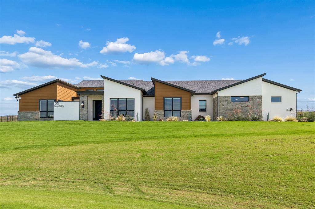 Tucked away in the serene Bella Crossing community, this stunning contemporary home offers the perfect balance of modern sophistication and quiet, suburban comfort. From the moment you pull into the drive, the crisp architectural lines and manicured curb appeal signal that you’ve found something truly special in the heart of the 76126. Step inside to an expansive, open-concept layout where natural light pours in through oversized windows, illuminating the rich flooring and high-end finishes throughout. The chef-inspired kitchen is a total showstopper, featuring sleek cabinetry, premium appliances, and a massive island that’s practically begging for a charcuterie board and a bottle of wine when friends drop by. It flows effortlessly into the living area, creating a seamless space for everything from cozy movie nights to lively holiday hosting. The primary suite serves as your own private sanctuary, complete with a spa-like bathroom that turns your morning routine into a retreat. Each additional bedroom is generously sized, offering plenty of flexibility for a home office, a dedicated fitness room, or a creative studio. Outside, the backyard is a blank canvas ready for your vision—whether that’s a lush garden, a custom patio, or just a peaceful spot to catch the Texas sunset. Located just minutes from local favorites and with easy access to the best of Fort Worth, 12311 Bella Cirro Dr isn’t just a place to live; it’s the lifestyle upgrade you’ve been waiting for. Come see why this one feels like home the second you walk through the door.