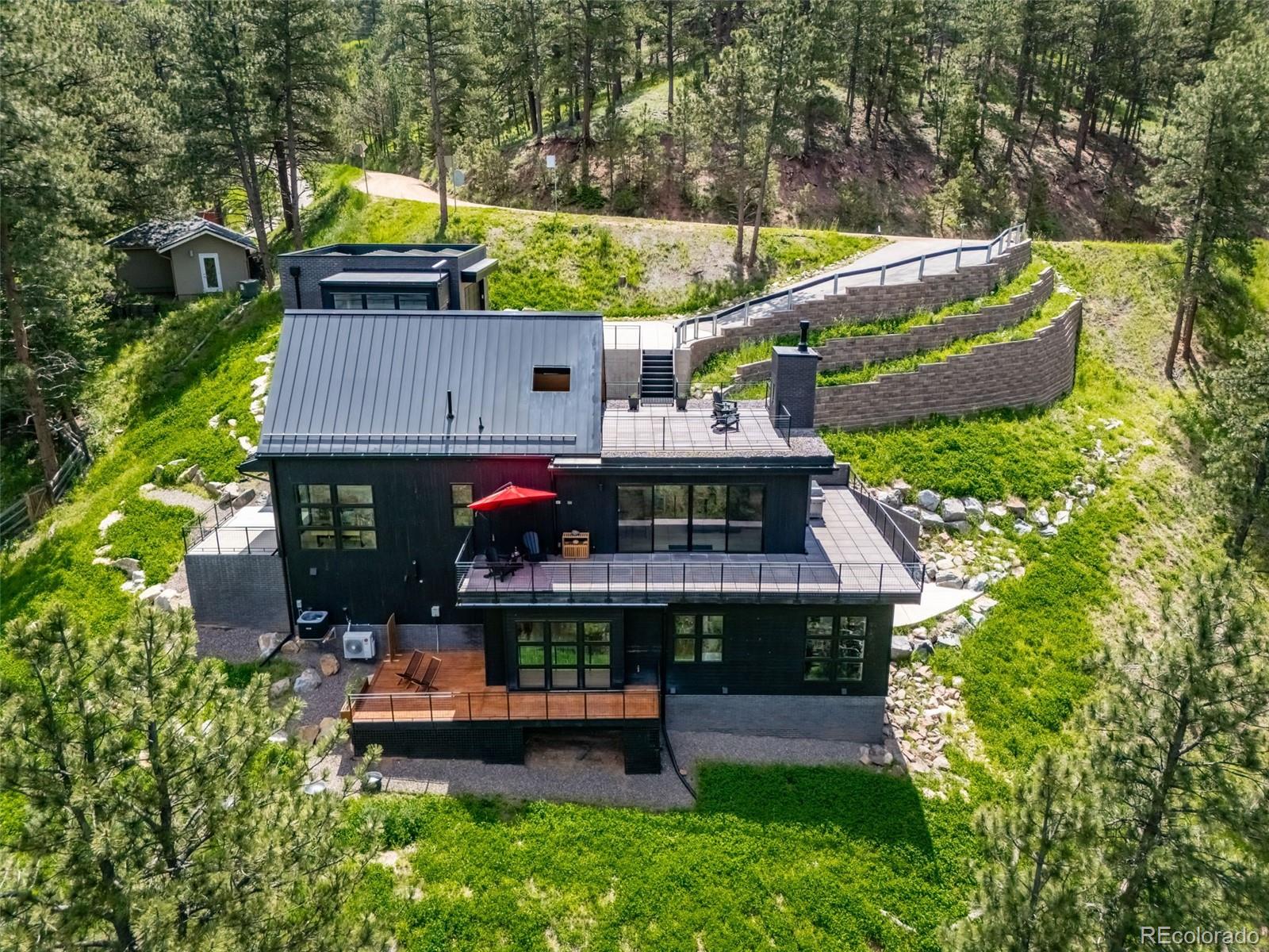 **Colorado Mountain Elegance Meets Modern Luxury – Minutes to City Life**Welcome to your dream retreat nestled in the majestic foothills of beautiful Boulder, CO. This one-of-a-kind custom home blends the serenity of mountain living with the sophistication of cutting-edge design and technology.  Boasting 4 spacious bedrooms and 4 spa-inspired bathrooms, this residence is a Masterpiece of Craftsmanship and comfort. From the moment you arrive, you're greeted by breathtaking panoramic mountain views, multiple patios, outdoor fireplace, and a Welcoming A-Frame Foyer.  The expansive wrap-around deck located along main level, is perfect for entertaining, soaking in the sunrise/sunset, or enjoying your favorite beverage.  Inside, the heart of the home is a chef’s dream kitchen, with top-of-the-line Thermador appliances, custom cabinetry, pantry, and elegant finishes making every meal a culinary experience. Open-concept living, spacious laundry room complete with washer/dryer is wisely located near lower bedrooms.  A home elevator provides effortless access to the various levels, while the owned solar panels offer energy efficiency and sustainability. Every detail has been thoughtfully curated to offer a lifestyle of ease, elegance, and connection to nature.  Whether you're hosting guests or enjoying a quiet evening under the stars, this home offers the perfect balance of mountain tranquility and modern convenience.  EXTRA BONUS:  This very special home is located within the heart of all which the Sundance Film Festival will be bringing to Boulder and its extremely well priced below the 2025 appraisal of $2.89M.  Premium location near Open space, trails, or a short drive from the vibrant culture and amenities of Boulder.  This home is more than a residence—it's a lifestyle of luxury, sustainability, and connection to nature, all within easy reach to enjoy the city life Boulder has to offer. Pride of Ownership! A Must See Home!