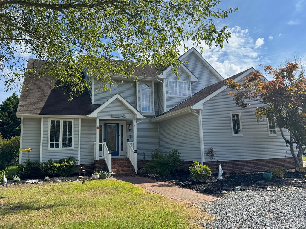 Your dream home awaits! This stunning contemporary home situated in an established community. Offers water views from the living room and primary bedroom. The primary suite opens to the back deck, filling the space with natural light. Lovingly renovated over the past few years, it features a remodeled kitchen and bathrooms, including heated floors in the primary bath. Windows and an open-concept kitchen create a bright, airy feel throughout. Outside, enjoy your private deep-water dock with boat lift—ready for the Shore life. Imagine the boating adventures to local waterfront restraunts, Island beach days and great fishing. Do you like rockfish? You could catch them right off of your dock. This is a piece of paradise for someone who loves the water and all that it offers.