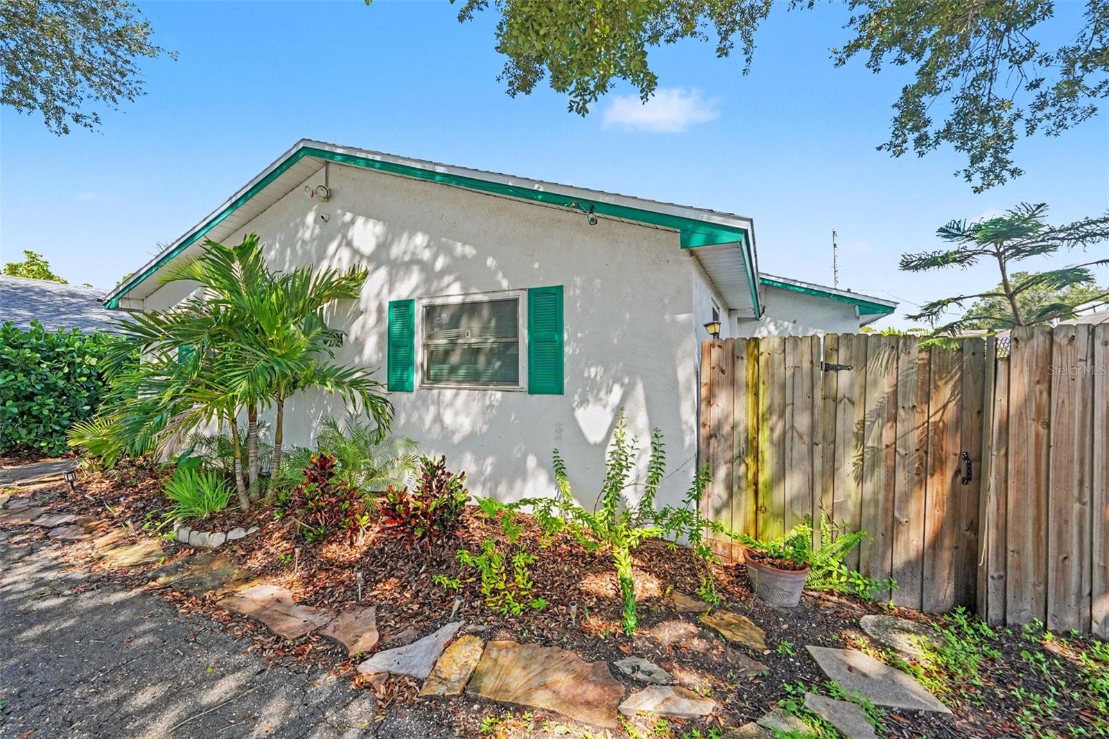 Perfect for short term rentals.  Pinellas Park has no short term rental restrictions.  This turn key duplex is a fantastic investment property.  Each unit has 2 bedroom and 1 bathroom, impact rated windows and impact related sliding glass doors, modern updated kitchen and bathroom, a dedicated laundry room with washer and dryer, its own fenced back yard, garden areas and patio, separate meters for electric and  water/trash/sewer, and 2 assigned parking spaces for each unit.  Rent out one side and rent the other .  Other amazing features include shingle roof replaced June 2021.  Central heat and air replaced June 2017, fresh interior paint (2022), ceiling fans and situated on a tree shaded lot.  Conveniently located to restaurants, shopping and interstate access.