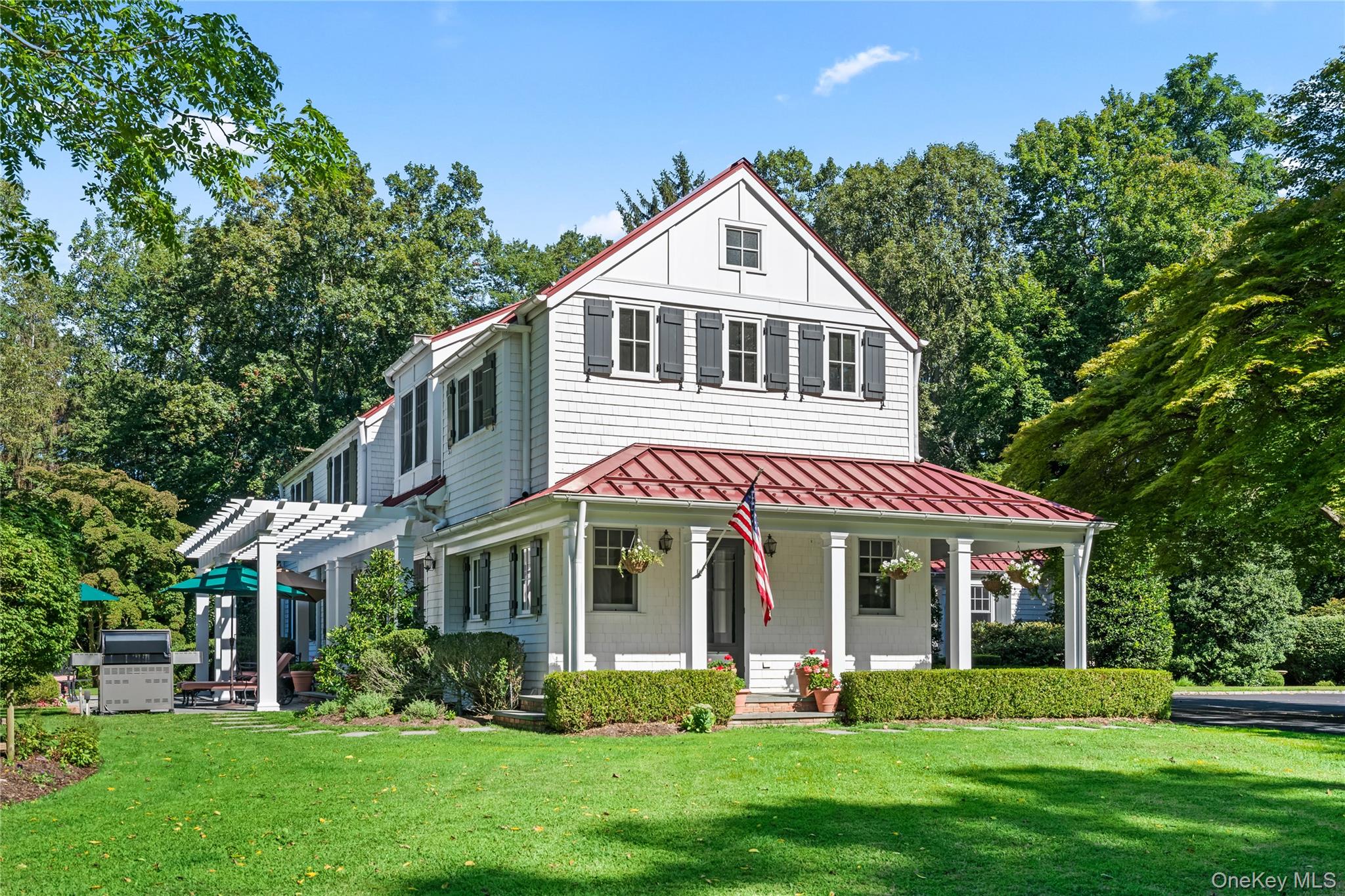 Every once in a while, a very special home will hit the market, and "Dogwood Meadow" is just one of these! This spectacular Mini Estate is located on 4.3 bucolic acres in the most Prestigious enclave in all of Lloyd Harbor Village. A winding dogwood tree lined driveway leads to a completely gut renovated home sequestered in the center of the property with perfect privacy. The main house features a wrap around porch which opens to an entertainment area with a lawn and patio with a pergola. Upon entering into the foyer, you are greeted with gleaming hardwood floors, and custom all wood windows which frame every room making for a bright and light filled home. Further adding to the incredible detail are fine mouldings and woodwork along with custom built-in cabinetry. The first floor bedroom can be used as an office and has an ensuite full bathroom. There is a cozy family room adjacent to the elegant living room with a fireplace, window seat and built-in cabinets. One of the most charming rooms in the home is a sun parlor located off the living room, with radiant heat and walls of glass which brings the outside right into the home. A formal dining room leads to a custom Chef's kitchen with a dining area. The designer appliances include double Miele dishwashers, a Sub-zero refrigerator, 2 Sub-zero refrigerator drawers, a Wolf wall oven, microwave and warming drawer. The Wolf 6 burner range features an additional 2 ovens making for effortless entertaining. The laundry area adjacent to the mudroom features 2 Electrolux washer/dryers and a spacious office with 2 built-in desks and custom cabinetry to match the kitchen. The first floor also features 2 powder rooms, one at the entrance foyer and the second off the mudroom entrance. Upstairs you will find a beautiful primary suite with radiant heat, full built-in closets, 2 window seats, a dressing area, and an additional walk-in closet. The ensuite spa bathroom is gorgeous and is tiled with marble with custom cabinets. It too has radiant heat, double sinks, a shower and a tub. There is a second junior suite with a dressing area, and a full bathroom. An additional 3 bedrooms with a bathroom complete the upstairs living space. Every closet has been professionally designed, and there is radiant heating in most of the bathrooms, the primary suite, the sun parlor, the kitchen and the mudroom. A separate 3 car garage hosts additional finished living space above. It has full radiant heat, with a separate furnace, central air and it's own alarm system. This is one of the few streets in Lloyd Harbor Village that has natural gas heating, and the estate features a whole house generator for the main house as well as the garage. Also located on the grounds is a greenhouse and a vegetable garden with raised beds and a full sprinkler system. The location cannot be beat for convenience within the prestigious Jennings Association. Huntington Village with world class shopping, entertainment, and restaurants is just 5 minutes away. The seaside town of Cold Spring Harbor with it's charming boutiques and renowned restaurants is also a 5 minute drive away. The home is extremely convenient for commuting to the Cold Spring Harbor train as well as the LIE.  Additionally, residents can avail themselves of amenities offered by Lloyd Harbor Village beach park with its tennis and pickle ball courts, BBQ areas, picnic facilities, bathhouse and changing rooms and a large playground. In the summer, there is a beach camp for kids with a life guard at the beach and lessons in tennis, sailing and water-skiing. This Estate offers an unparalleled lifestyle and superb convenience to everything!