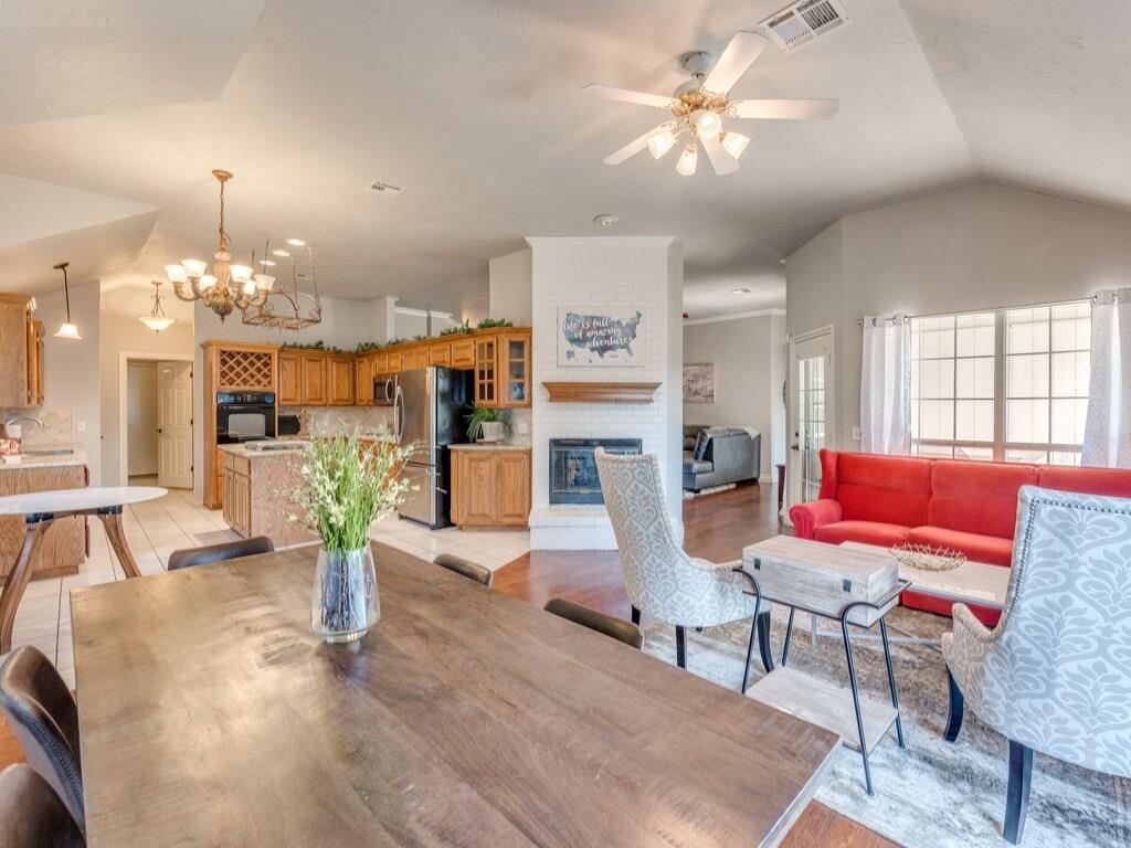 FABULOUS 4 BEDROOM, 2 BATH HOME IN BEAUTIFUL WOODLAKE ESTATES! One of the most coveted, family-friendly communities in the area! Perfectly situated in a neighborhood that is loaded with amenities that make every day feel like a getaway. Enjoy access to a beautiful COMMUNITY CLUBHOUSE, POOL, PARKS, & PEACEFUL WALKING TRAILS. With convenient access to I-35, Tinker AFB and OU Campus. You're never far from shopping, dining, & everything you need. You'll LOVE the charming curb appeal & spacious oversize garage that welcomes you home to a thoughtfully designed split floor plan – featuring tall ceilings, rich solid wood flooring throughout, bright windows, crown molding, granite counter tops, & a cozy dual fireplace that sets the tone for comfort & style. The heart of the home is a beautifully designed open kitchen featuring a large island, gleaming granite countertops, stylish tile backsplash, large pantry & a sunny kitchen dining —perfect for morning coffee or evening meals with loved ones. The spacious primary suite is a true retreat, offering double vanities, a large, soaker tub, an oversized walk-in shower & a massive walk-in closet. All additional bedrooms are generously sized! The secondary bath provides plenty of space for family or guests. Great storage throughout the home! Step outside to enjoy a large backyard with a covered spacious patio—ideal for grilling, relaxing or entertaining. Additional features include keyless entry front door, a 10-person walk-in storm shelter located in the garage. Additionally, you are adjacent to the Community Swimming Pool & have Access to the Club House for Personal or Private Gatherings by reservation through the HOA. GREAT NORMAN SCHOOLS! This home is absolutely pristine, move-in ready, & packed with features your family will appreciate every day. Come see why this gem in WOODLAKE ESTATES is everything you've been waiting for!
