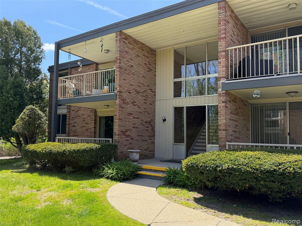Welcome to one of the best locations in Country Club Manor! This spacious two-bedroom, two-bath, New York–style condo offers hardwood floors, generously sized rooms, well-appointed bathrooms, and abundant storage, including a large basement area with laundry. The updated kitchen features modern finishes, while newer windows, moldings, and fresh paint add a clean, contemporary touch throughout. Step outside to enjoy your large covered patio/terrace overlooking peaceful, private green space—perfect for relaxing or entertaining. Just steps away, you’ll find the community pool for added leisure. Ideally located near upscale dining, the area's finest specialty markets, Equinox Fitness, and exclusive Oakland Hills Country Club and The Birmingham Athletic Club, this home combines comfort with convenience. A covered carport is also included.******OPEN HOUSE 12-2 PM SATURDAY, MAY 9