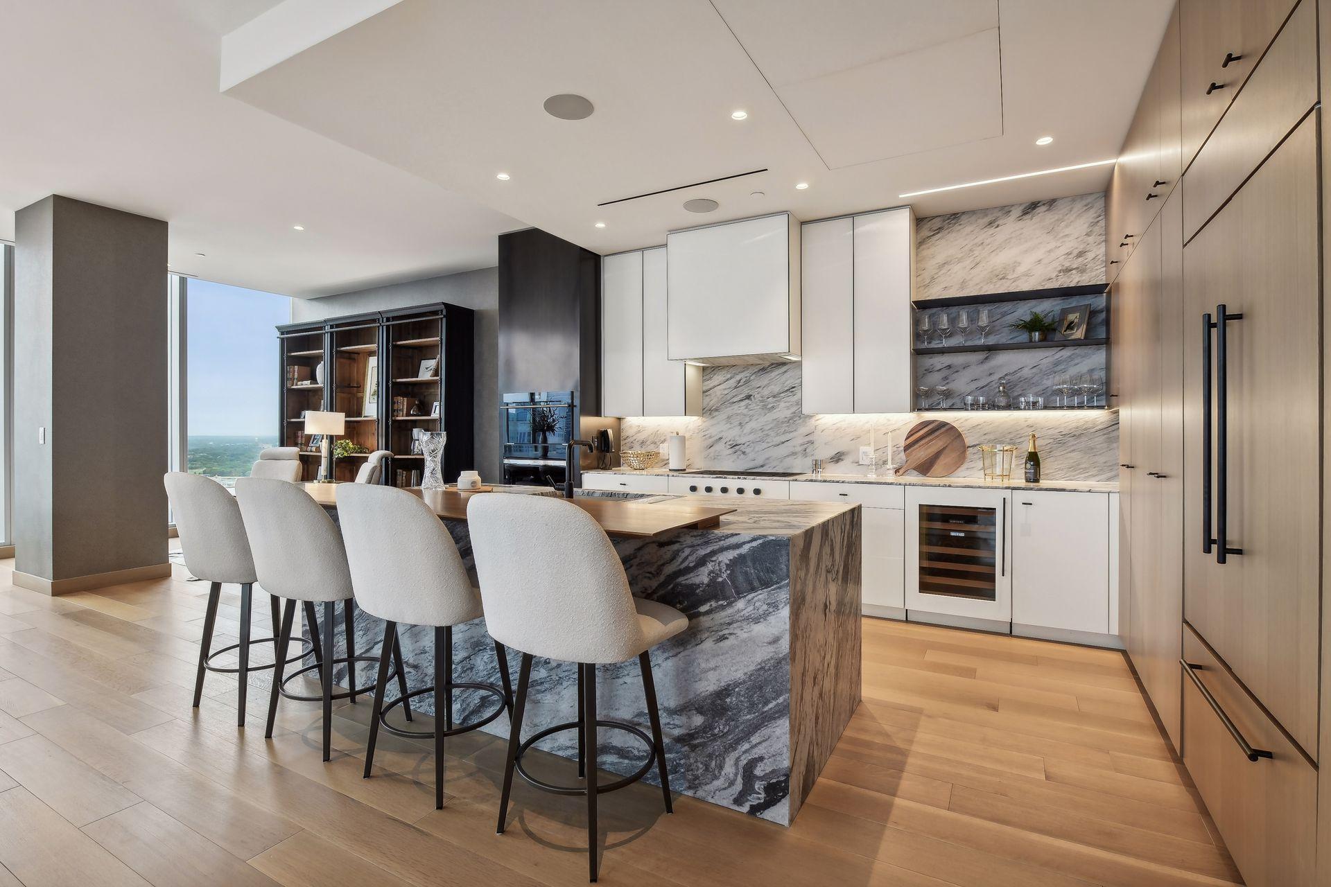 Welcome to the new standard of luxury living in Minneapolis. Step inside this magnificent Four Seasons residence, thoughtfully crafted for the most discerning buyer. The great room seamlessly integrates with an open kitchen adorned with hand-selected natural stone slab countertops and White Oak wall cabinets. A suite of fully integrated appliances, including a Wolf flush-mounted gas cooktop, Wolf oven, Subzero under-counter wine refrigerator, elevates the culinary experience. The primary bedroom suite boasts stunning unobstructed views. Experience luxury with the oversized custom walk-in closets and exquisite custom doors. The opulent primary bathroom delights with a custom-designed double vanity and integrated sink, a 6-foot freestanding, and a lavish custom-designed shower and a full-height glass door. The Four Seasons Residences are an exclusive collection of 34 one-of-a-kind condominiums. This address places you at the epicenter of excitement and creativity, offering a lifestyle like no other. Owners additionally have access to a full-service staff, and all of the hotels services and amenities such as the spa, fitness center, lounge, rooftop pool terrace, sauna, restaurant, and more.