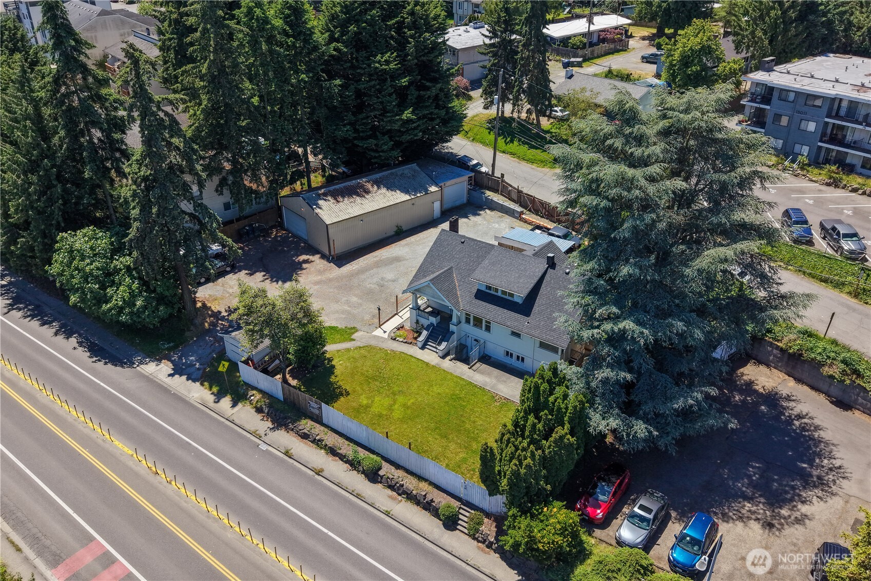 Exceptional redevelopment, investment, or owner-user opportunity in the heart of Burien! Offered together, 13000 & 13025 Ambaum Blvd SW encompass two tax parcels totaling approximately 15,246 sq ft. Zoned MU-1 (Mixed Use 1), allowing for a wide variety of residential, commercial & mixed-use development possibilities.Featuring a classic 1923-built home configured as two residential units; the Main unit is 1.5 floors, 3 bds/1.75baths and the Lower unit has 2 bds/1bath, laundy in both units.The Shop is around 1,700-sq ft, a Metal building, with heated shop space, heated office area a 1/2 bath. Perfect for contractor operations, vehicle enthusiasts, workshop space, or future redevelopment plans.Located on the highly visible Ambaum BLVD corridor, this property benefits from strong traffic counts, excellent access to downtown Burien, Sea-Tac Airport, major transportation routes, shopping, dining, and public transit. The MU-1 zoning designation provides significant upside potential for developers, investors, and entrepreneurs seeking to capitalize on Burien's continued growth and revitalization. Whether you're looking to generate rental income while planning future development, establish a live/work environment, or pursue a mixed-use project, this rare two-parcel offering presents outstanding potential in a rapidly evolving market. Buyer to verify all development potential, zoning regulations, permitted uses, density allowances, and utility availability to their satisfaction.