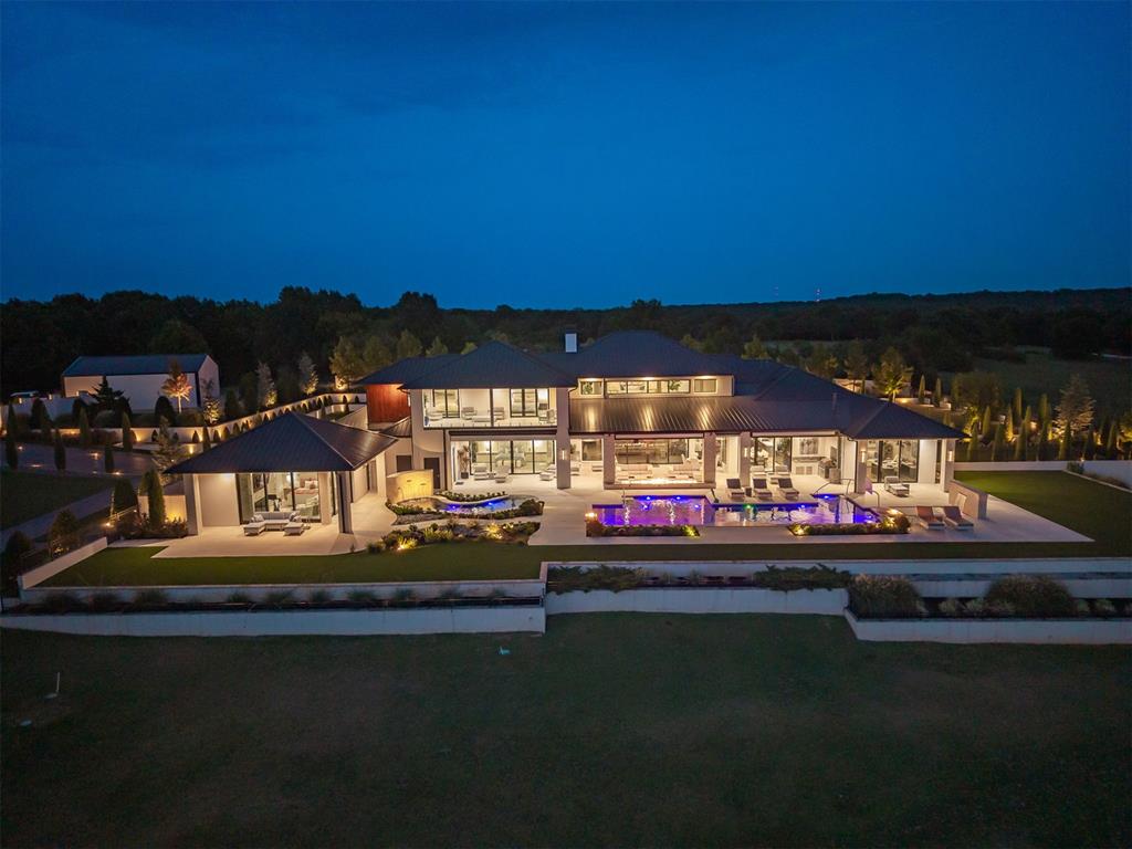 There are luxury homes, and then there is Diamond Bluff Cove. This is a legacy compound, perched above the panoramic waters of Keystone Lake, roughly 20 minutes from Tulsa, and built without a single compromise. Pass through the private gated entry and the scale of this estate reveals itself slowly, the way it should. A modern architectural masterpiece anchors the property, framed by resort-style pool living, phantom shades, and a private pool casita designed for effortless entertaining. Step outside to an outdoor kitchen and sweeping balcony views that make Keystone Lake feel like it belongs to you alone. Beyond the main residence, this compound delivers what almost no other property in Oklahoma can. A barn with stalls and full living quarters for the equestrian at heart. A nearly 3,000 square foot guest home for family, friends, or full-time staff. A large, modern workshop built for serious hobbies and serious toys. And a private drive leading directly to your own beach and boat dock, where the lake becomes an extension of the home itself. Over $3,000,000 has been invested in landscaping alone, transforming the grounds into something closer to a private resort than a residential lot. No expense was spared, and it shows in every detail, from the hardscaping to the horizon. There is also turf grass surrounding the entire main property.This is the ultimate lake retreat for the outdoor enthusiast and the horse lover alike, a rare offering where privacy, land, water, and design come together at a scale that simply cannot be replicated. Diamond Bluff Cove isn't just a home. It's a compound built for a legacy. See website for additional photos and info.