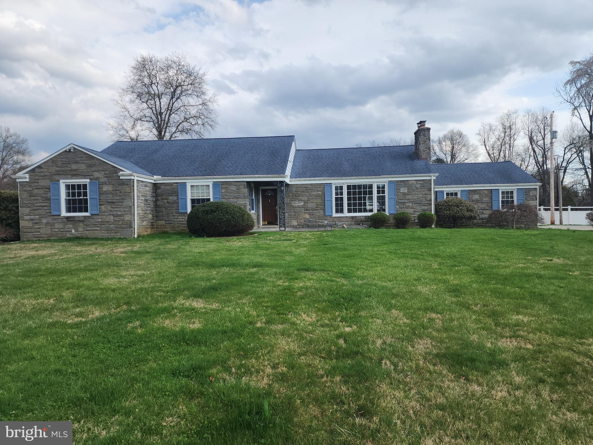 Welcome to 1522 Evergreen Lane, Berwyn! This all stone cape cod is in move in condition and sits on a 1.2 acre open, level corner lot! Home was fully renovated in 2000 with many custom features including brazilian cherry flooring , sunburst exotic wood inlay wall in den/office, crown moldings, wainscotting/shadowbox trim, heated foors in kitchen and bathrooms , 3 zoned oil hotwater baseboard heat system and central air and central vac.  The kitchen features Ceramic tile floor and custom cherry cabinets and a door to the rear patio w/awning. Gas fireplace in living room with large picture window. Slate floor front entry and spacious rooms throughout. The 2nd floor offers an office area/hobby room and full bath. There's an attached 2 car garage and a full unfinished basement with a bilco outside entrance. Outside , the yard is well manicured with quality shrubs and a fountain in the front yard.  Stamped concrete driveway and front walkway. The lot has plenty of room for a sizable addition and pool area. This home is located just across Darby Road and the Waynesborough Country Club.