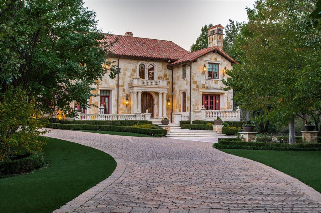 Sited on 2.78 private acres behind mature landscaping, this 10,641 SF Mediterranean residence offers Texas-sized livability and luxury amenities. Built in 2011, the home spans two levels with five ensuite bedrooms, multiple living and dining areas, and extensive outdoor features. The living room features 22’ cathedral ceilings, a European fireplace mantel, and Venetian plaster walls. Library offers leather ceilings, grass-cloth walls, glass-front cabinetry &  a wet bar; the adjoining gun room includes metal doors, illuminated cases, & secure storage.The main kitchen is equipped with a 60” Wolf gas range (6 burners, griddle, double ovens), Sub-Zero refrigeration with drawer units, 2 sinks including copper farmhouse sink, pot filler, warming drawer, beverage fridge & abundant custom cabinetry. The 1st-floor primary suite includes hardwoods, patio access, fireplace with European mantel, heated floors, garden tub, large shower, dual vanities & makeup vanity. Her dual-room couture closet includes island & custom storage; his closet offers equal finish & organization.A full mother-in-law suite includes a kitchen with Fisher & Paykel appliances, gas range, refrigerator-freezer, pantry, built-ins, bar seating, French doors to terrace, walk-in closet & full bath. Upstairs are 3 guest suites with garden-style baths and makeup vanities, one with private living area. Additional spaces include a home office, utility room with exterior access, LG W-D, sink, drip-dry area &  glass-front fridge, a billiard room with terrace, theatre with 6 seats & full AV, wet bar, wrapping-craft room, & climate-controlled storage.Outdoors: cabana with fireplace & TV, pergola dining, pool & spa with Italian glass tile and fountains, artificial turf, putting green, firepit, sports court with lighting-speakers, & full outdoor kitchen. Mechanical systems include 6 HVAC units, Control4 automation, Generac generator, RO irrigation water tanks, pump house, landscape lighting, private hydrant.