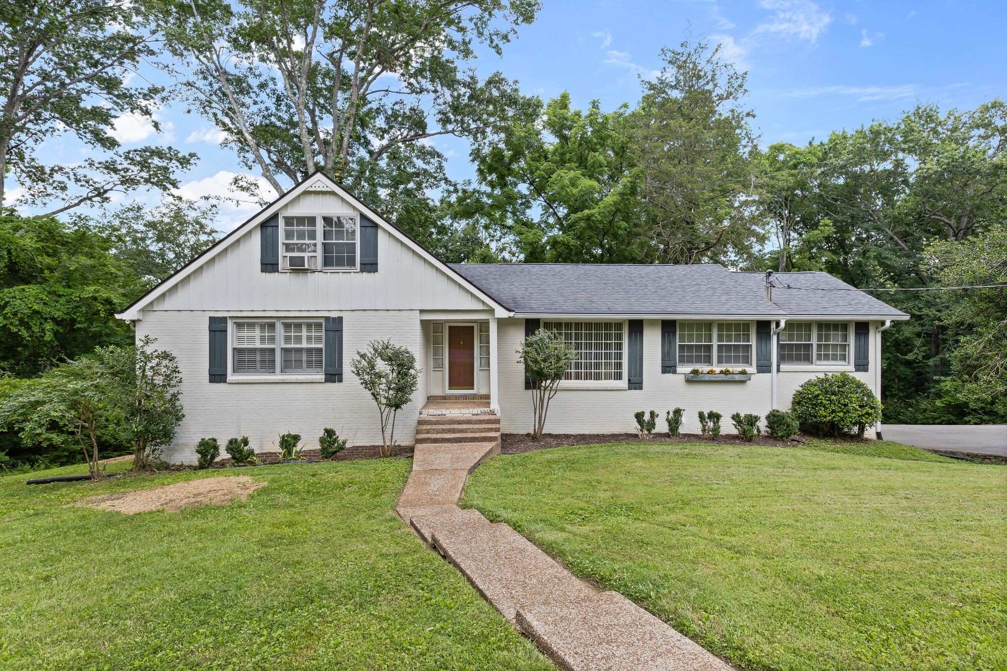 OPEN HOUSE Sunday 6/29 2-4p! This private 1.4-acre property features a creek and wooded setting, offering both tranquility and proximity to Franklin and Cool Springs. Located in the esteemed Grassland Estates, you are just a minute away from Grassland Elementary and Middle School. With 5 bedrooms, 3 bathrooms, and ~1189ft of heated/cooled unfinished space below, it’s ideal for someone ready to finish the lower level into a workshop, guest suite, media room—or whatever’s needed. The main floor offers solid living space with room to refresh and personalize. Outside, the large lot invites opportunities for decks, gardens, fire pits, or a creekside retreat—without HOA constraints. Located just minutes from Franklin’s historic downtown and Cool Springs’ shopping and dining, this home uniquely blends private, rural feel with access to premier amenities.