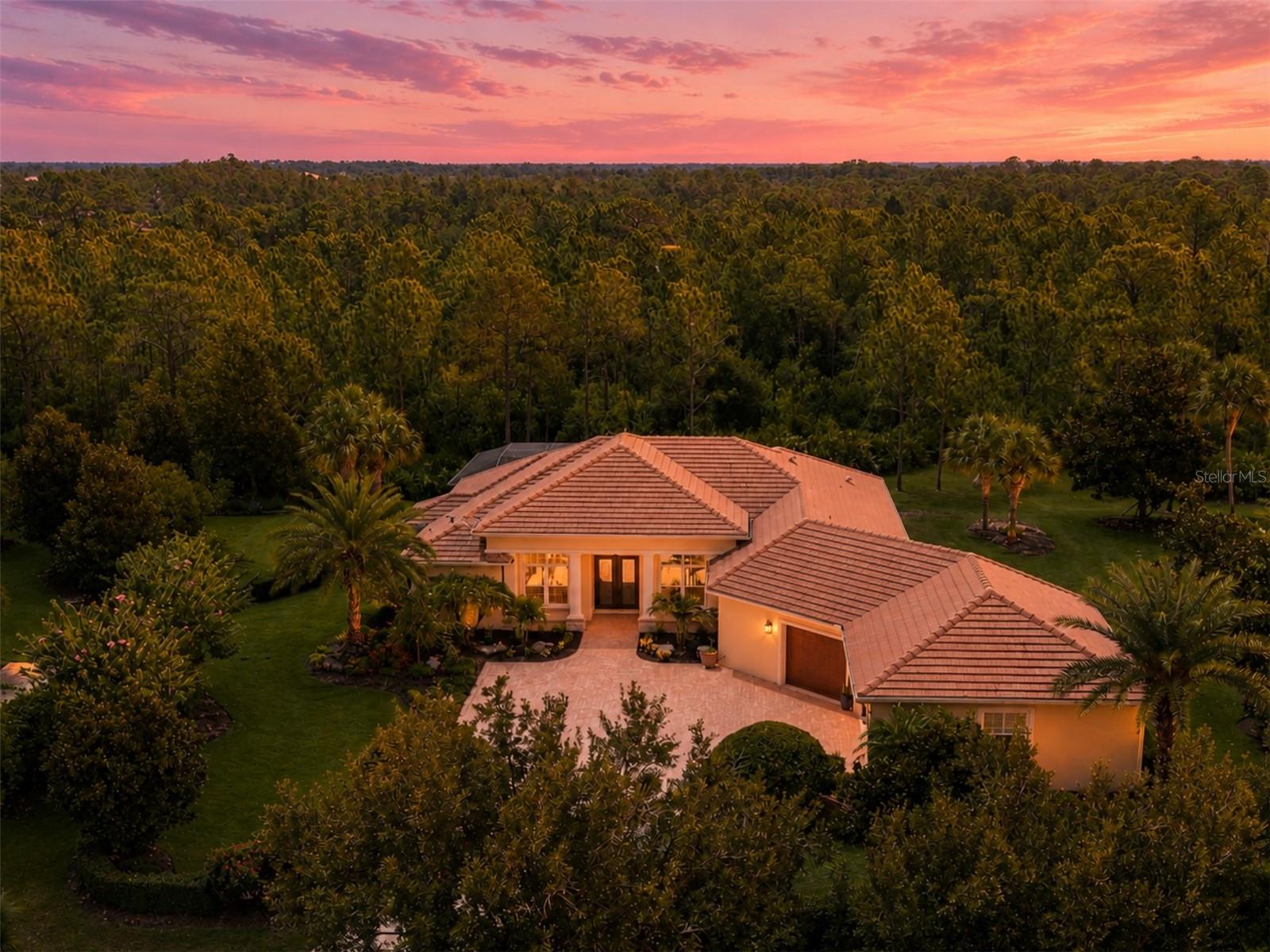 Virtually Staged. This exquisite custom-built home is a true value in The Concession. Set on a private half-acre homesite, this Johnson Home estate defines true privacy, with only the sights and sounds of the expansive preserve and its abundant wildlife surrounding you. This exceptional residence offers nearly 3,000 square feet of thoughtfully designed living space with designer touches throughout, including a coffered ceiling in the great room, upgraded fixtures with LED lighting, and crown molding throughout the home. The gourmet kitchen is equipped with Bosch appliances, quartz countertops, upgraded white cabinetry, a tile backsplash, a large center island, double wall ovens, and a gas cooktop, creating the perfect space for everyday living and entertaining. The heated saltwater pool features a PebbleTec finish and overlooks the tranquil preserve, providing a peaceful outdoor retreat. Additional features include solid wood interior doors, impact-rated windows, doors, and sliders, Icynene spray foam insulation, a tankless gas water heater, whole-house generator, Sonos surround sound for the great room television, and a centrally controlled whole-home music system. The impressive oversized garage features 18-foot double and 10-foot single garage doors, upgraded LED lighting, ceiling storage, and a built-in garage storage system, providing ample space for vehicles, hobbies, and organization. Located behind the private gates of The Concession, residents enjoy one of Florida's most acclaimed golf destinations, featuring the Jack Nicklaus and Tony Jacklin-designed championship course, elegant clubhouse, dining, and miles of scenic natural beauty, all just minutes from Lakewood Ranch, Waterside Place, University Town Center, and Sarasota's world-renowned beaches.