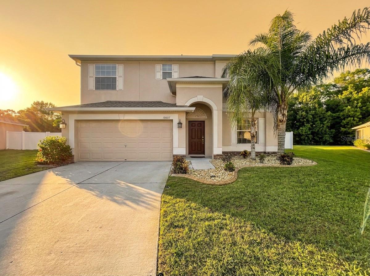 Virtually Staged. Centrally located in the beautiful Briar Oaks community in Pasco County, this proud ownership home offers a comfortable layout with a formal living room, formal dining room, and a separate family room. The kitchen features granite countertops, plenty of cabinet space, a kitchen island, and stainless-steel appliances — perfect for cooking and gathering. All bedrooms are upstairs, along with a convenient laundry room. The master bedroom includes an en-suite bathroom with dual sinks, a bathtub, and a separate shower. Bedrooms 2, 3, and 4 with ample space and closets. Outside, enjoy the screened lanai, lush green grass, and a vinyl privacy fence installed in 2025. With no rear neighbors, the backyard feels private and peaceful — great for relaxing or entertaining. The seller has already taken care of the major updates for you: new A/C (2025), fresh exterior paint (2025), new landscaping curbing (2025), and rain gutters (2025). The location is ideal for Florida living: easy access to the Suncoast Parkway for a smooth Tampa commute, and close to US 19 for trips to St. Pete, Pasco, and Pinellas beaches. Head north on US 19 to explore Weeki Wachee, the Homosassa River, and Crystal River, all offering beautiful natural springs and plenty to do. This home is move in ready and packed with updates you’ll appreciate from day one. Schedule your private showing today.
