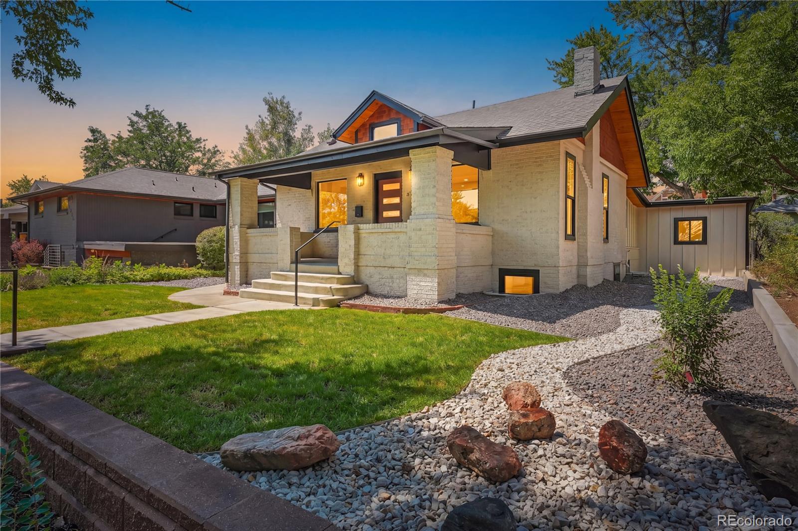 Thoughtfully designed to feel like new construction and finished like a custom home. White oak, cedar, and stone throughout four bedrooms, five baths, and a dedicated office - owned solar included, in the heart of Harkness Heights. The striking exterior pairs one-of-a-kind brick with black accents, all-new concrete, a tiered stone retaining wall, fresh landscaping, and a river-inspired design along the side of the home. Cedar tongue-and-groove wraps the eaves and covered front porch. Inside, a vaulted cedar-lined foyer with twin sculptural pendants opens to a bright main level with new white oak hardwood floors and a dramatic bookmatched slab fireplace. The luxury kitchen features ZLINE appliances, a professional range and stainless hood, flat-panel cabinetry, a waterfall quartz island, picture-window bench seating, and a walk-in pantry. A custom mudroom, office, guest bedroom with an attached full bath, and designer powder room complete the main floor. Set in the back of the home, the primary suite offers two walk-in closets and a spa-inspired five-piece bath with a freestanding soaking tub, brass chandelier, glass-enclosed rain shower, floating double vanity, and private water closet. Downstairs is an entertainer’s dream with a black-and-gold granite waterfall wet bar, original exposed brick, illuminated walnut shelving, glass liquor cabinet, ice maker, wine cooler, bar seating, linear fireplace, and LED-lit built-ins. Two additional bedrooms, a double-vanity bath, second powder room, laundry room, and new SPC flooring complete the lower level. Enjoy all-new HVAC, a tankless water heater, new plumbing and electrical, and fully owned solar. Outside, relax on the back covered porch or open patio surrounded by new sod, a privacy fence, and a mature shade tree. This exceptional home must be seen in person—come take a look!