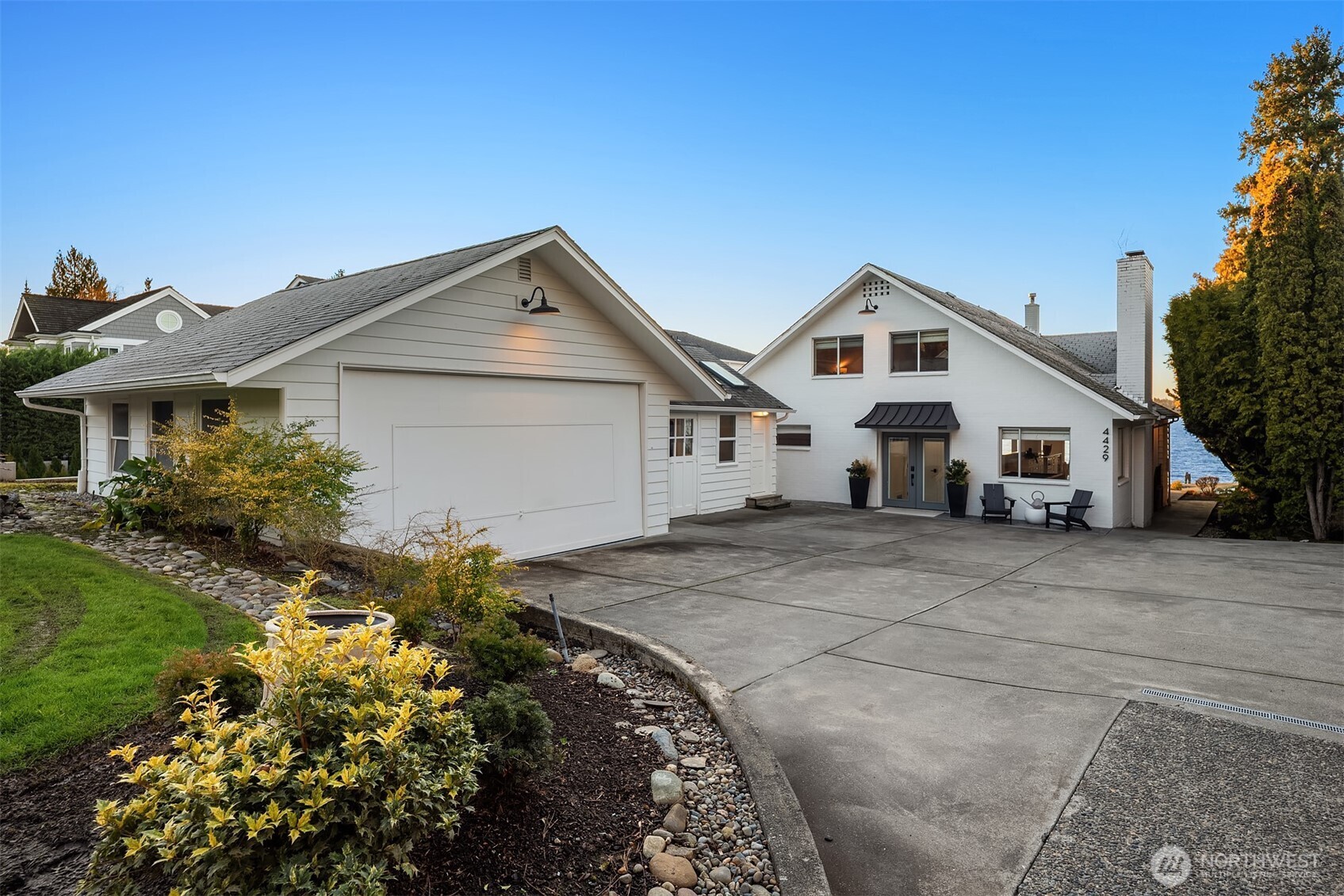 An elegant approach with a generous drive and inviting front entry.