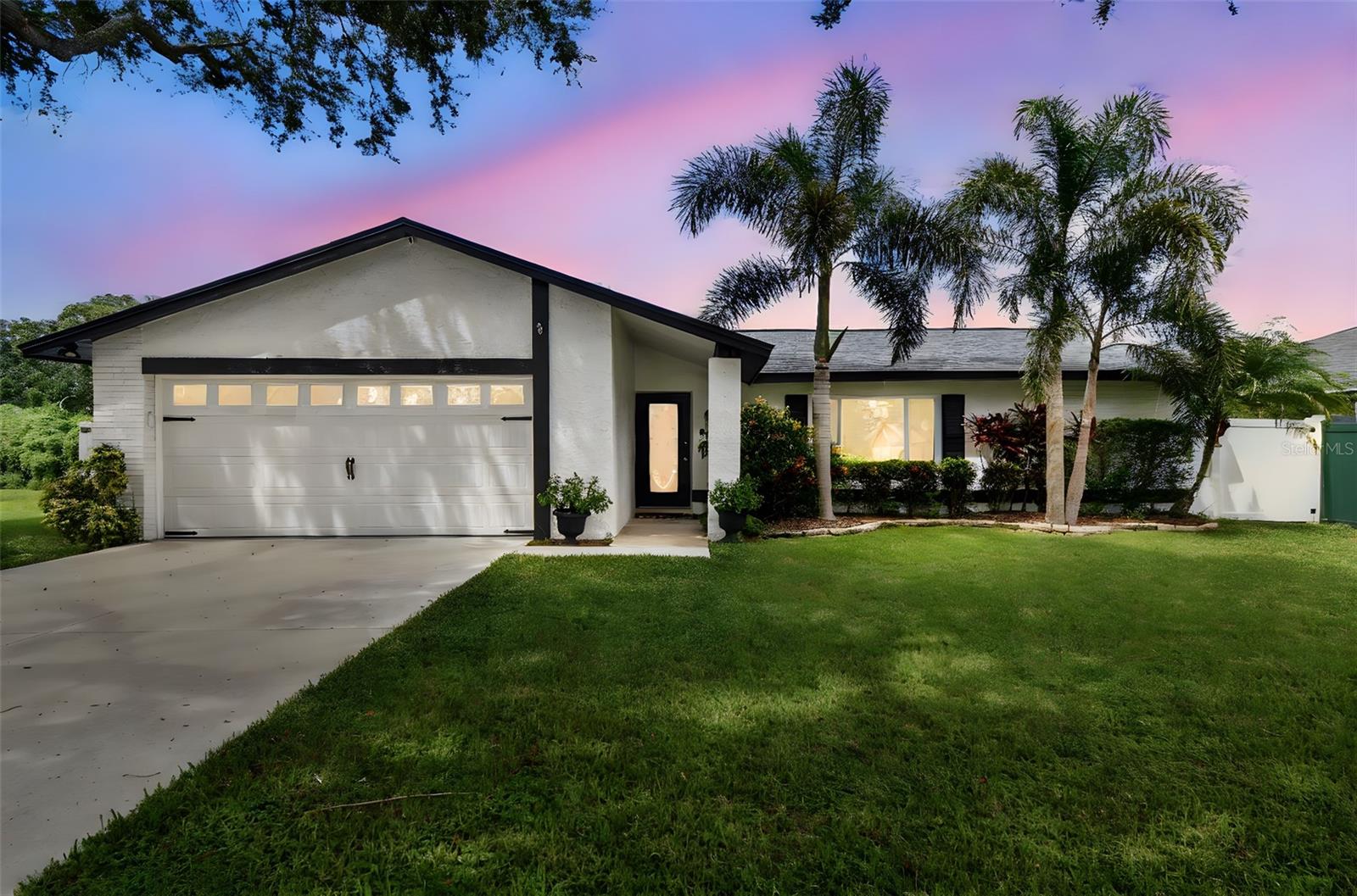 Striking 3 bedroom, 2 bath, pool home centrally located with no HOA!  This beautifully maintained and updated home offers 1495 SF of comfortable living space with an open floor plan, split bedrooms and best of all is move in ready!  All major concerns have been updated including new flooring and a remodeled kitchen, quartz counter tops and all new LG appliances in 2022.  Bathrooms were remodeled in 2018 and 2019. The roof was replaced in 2021 and new windows were installed in 2020.  AC was done in 2020 and a new water heater in 2022. Outside, the exterior was repainted within 5 years, a brand new Driveway installed done in 2021, a new garage door added in 2020 and a new garage door opener in 2024. The home also boasts a screened in pool with a newer pool pump and a large lanai area great for entertaining and relaxing.  If that's not enough, the home is beautifully landscaped and even has a quality built Shed in the back.  Don't miss this rare opportunity to own an amazing home in a great neighborhood! (Some photos have been added using Virtual Staging)