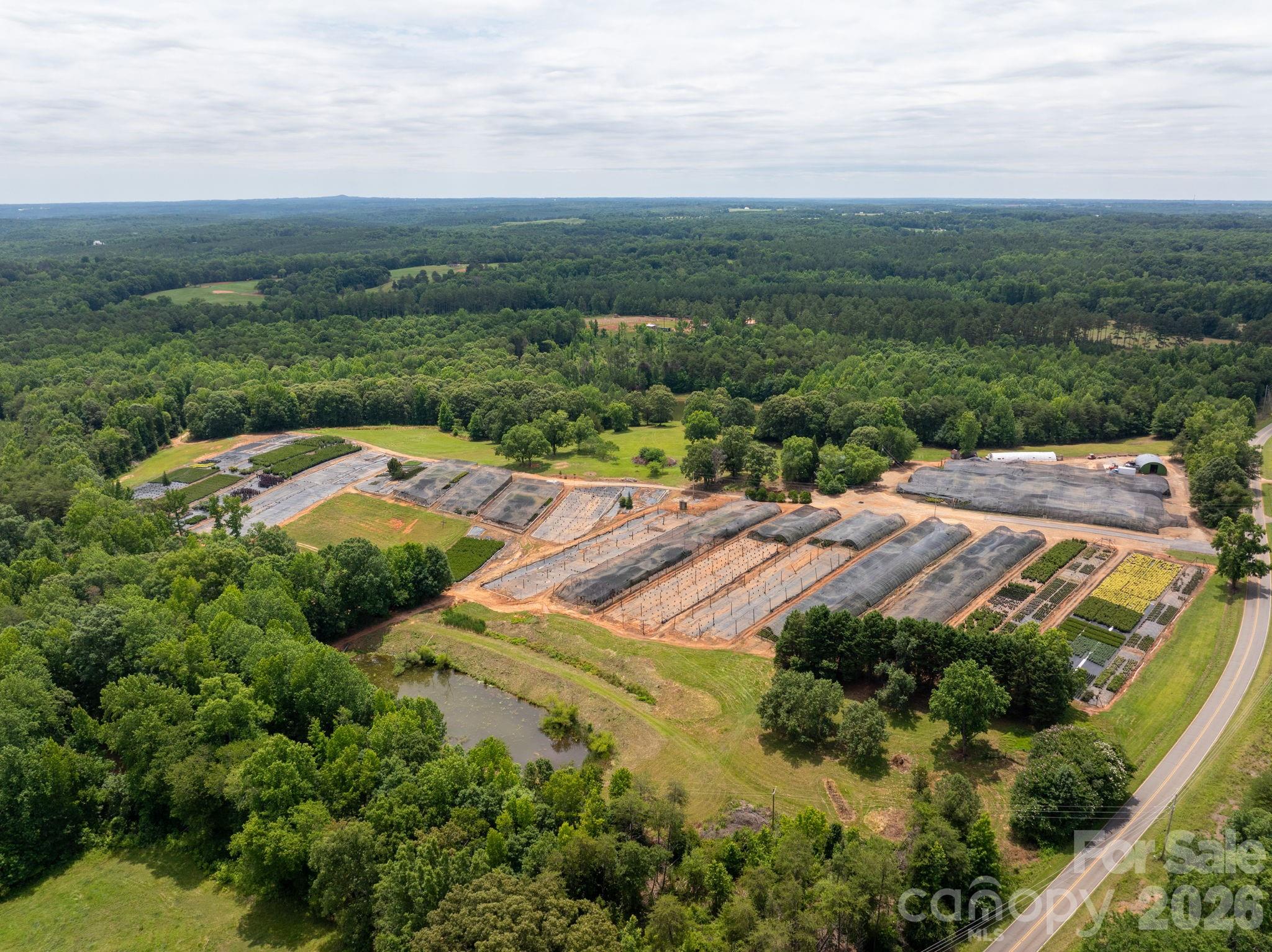 Great opportunity to own a functioning plant nursery in the foothills of North Carolina.  This property is surrounded by large acreage tracts with horse farms, cattle farms, agricultural tracts and peach farms.  This property has a 4-bedroom 4 bath home with a 2000 sq ft addition finished in 2025. Enjoy the level to gently sloping property with over 10 acres of greenhouses with irrigation and multiple acres matted with irrigation.  The property has a spring fed pond and two other irrigation ponds to supply the nursery plants. There are multiple wells drilled on site with 25 acres of timber lands with trails cut in for access. All equipment for farm included with sale at no value along with all plant inventory.  This is a great turnkey value add property, and it is ready for the next owner! Call today for more information or to schedule a viewing of the property.