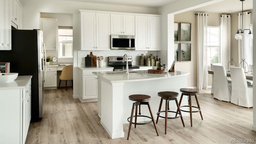 New Construction - July Completion!  Built by Taylor Morrison, America's Most Trusted Homebuilder! Granby at 39733 Penn Road in Independence is a spacious and flexible two-story floor plan designed to grow with you. The open-concept kitchen, casual dining area, and gathering room keep everyone connected, while the kitchen’s large island, walk-in pantry, and optional prep kitchen—or tech corner—offer smart functionality. A downstairs flex room adapts to your lifestyle, whether you need a home office, gym, or guest space. Upstairs, the expansive primary suite boasts two walk-in closets, joined by three additional bedrooms and a loft that can be converted into a fifth bedroom. The unfinished basement provides room to expand, and the backyard—backing to open space—adds a peaceful touch of privacy. Set in the scenic Independence community, you’ll enjoy rolling hills, open spaces, and new amenities, all just 10 miles from Downtown Parker and Highway 83. Additional Highlights include: covered patio and air conditioning. Photos are for representative purposes only. MLS#6796080