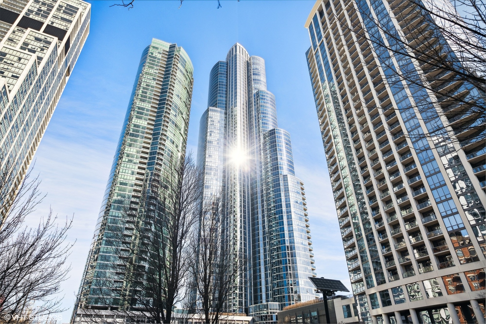 Enjoy incredible, protected, panoramic views of the lake, Grant Park, Buckingham Fountain, Museum Park, and the Chicago skyline from this 2920 SQFT NE corner residence at One Museum Park East. This residence features 9'2" ceilings, generous room sizes, and a flowing, thoughtful floor plan. The open living/dining room enjoys abundant natural light through floor-to-ceiling windows with stunning views, and walnut built-ins. With unobstructed views of the Navy Pier fireworks, the NASCAR race, Chicago marathon and more, this is the perfect place to entertain. The separate kitchen will make any cook or caterer happy with abundant counter and cabinet space, stainless steel appliances, and an eat-in area or family room. With an entire "wing" dedicated to the primary suite, this serene space is the perfect place to relax and recharge. This suite features a graciously sized bedroom with north-facing, skyline views, two walk-in closets, and an ensuite bath with Whirlpool tub, separate shower, double sink, linen storage, and private commode. Two additional bedrooms are located on the south side of the residence. The third bedroom is currently set up as a den/office with walnut built-ins. Two full baths with showers and a large laundry room with storage complete the space. Two extra-large, side-by-side parking spaces with an electric charger are availble for $45,000 for each parking space. One Museum Park East has two pools (one indoor, one outdoor), sauna, sundeck with BBQ and dining area, exercise room, two remodeled club rooms, 24-hour door staff, onsite property management, attached garage parking, and a social committee that plans events throughout the year.  Walk to Soldier Field, concerts, festivals, parks, playgrounds, museums, and public transit. South Loop Elementary School District. Welcome home!