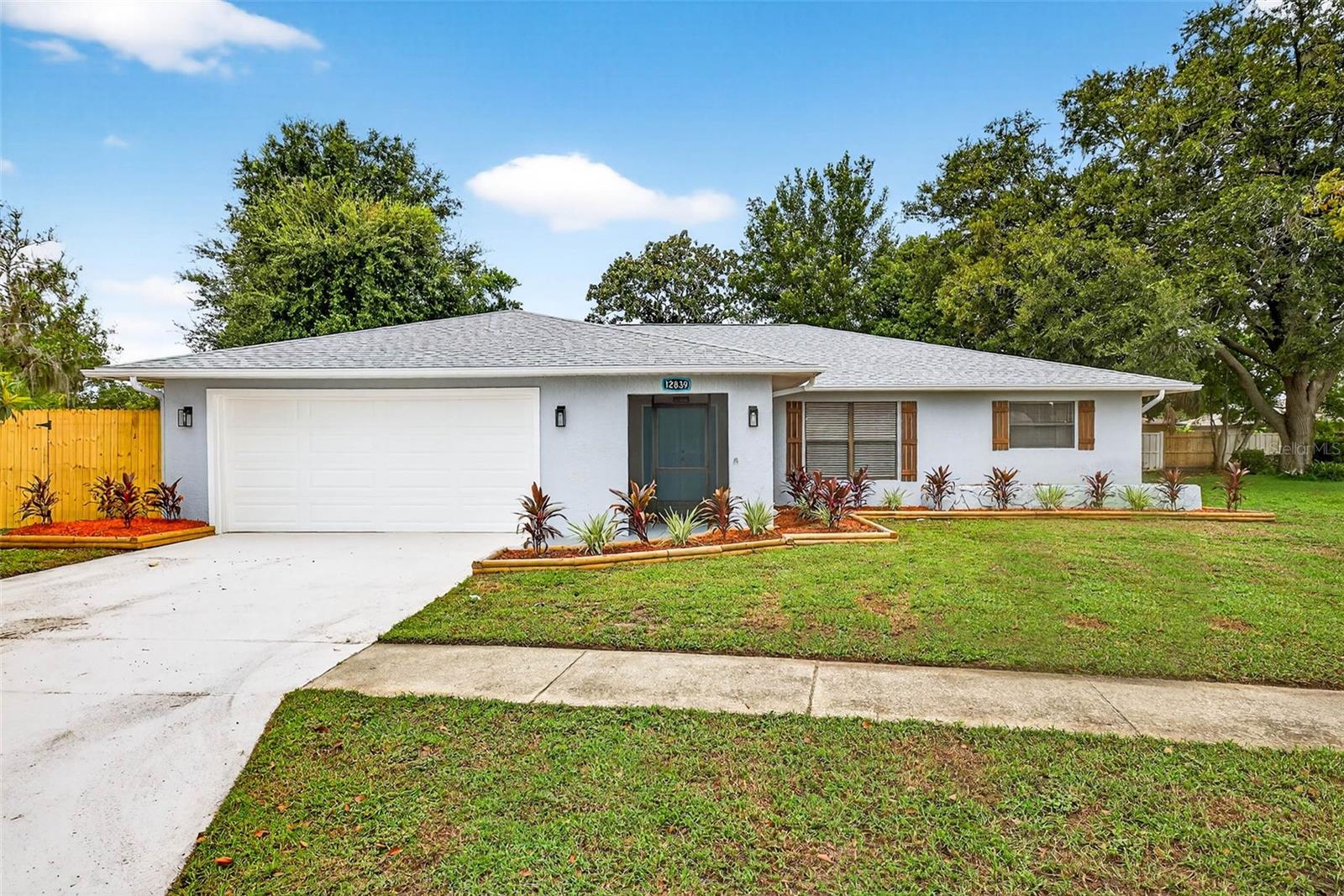 The seller offers up to $10,000 in buyer's closing concessions with a full price offer! Wonderful opportunity to purchase a fully renovated home in this quiet Hudson community, which is situated on one of the largest lots in the subdivision. This home's complete remodel features fresh inside and out paint, new luxury vinyl flooring throughout, brand new kitchen shaker style cabinets with new quartz countertops, new stainless-steel appliances, new modern lighting fixtures. The bathrooms have been also completely remodeled and ready for you to enjoy! The roof is brand new (2025), the HVAC is brand new as well (2025). The backyard is spacious and ready for entertaining surrounded by privacy fence. The landscaping around the home has gone through a complete renovation and looks beautiful. This home is maintenance free for your Florida living.  Make an appointment and see it today!