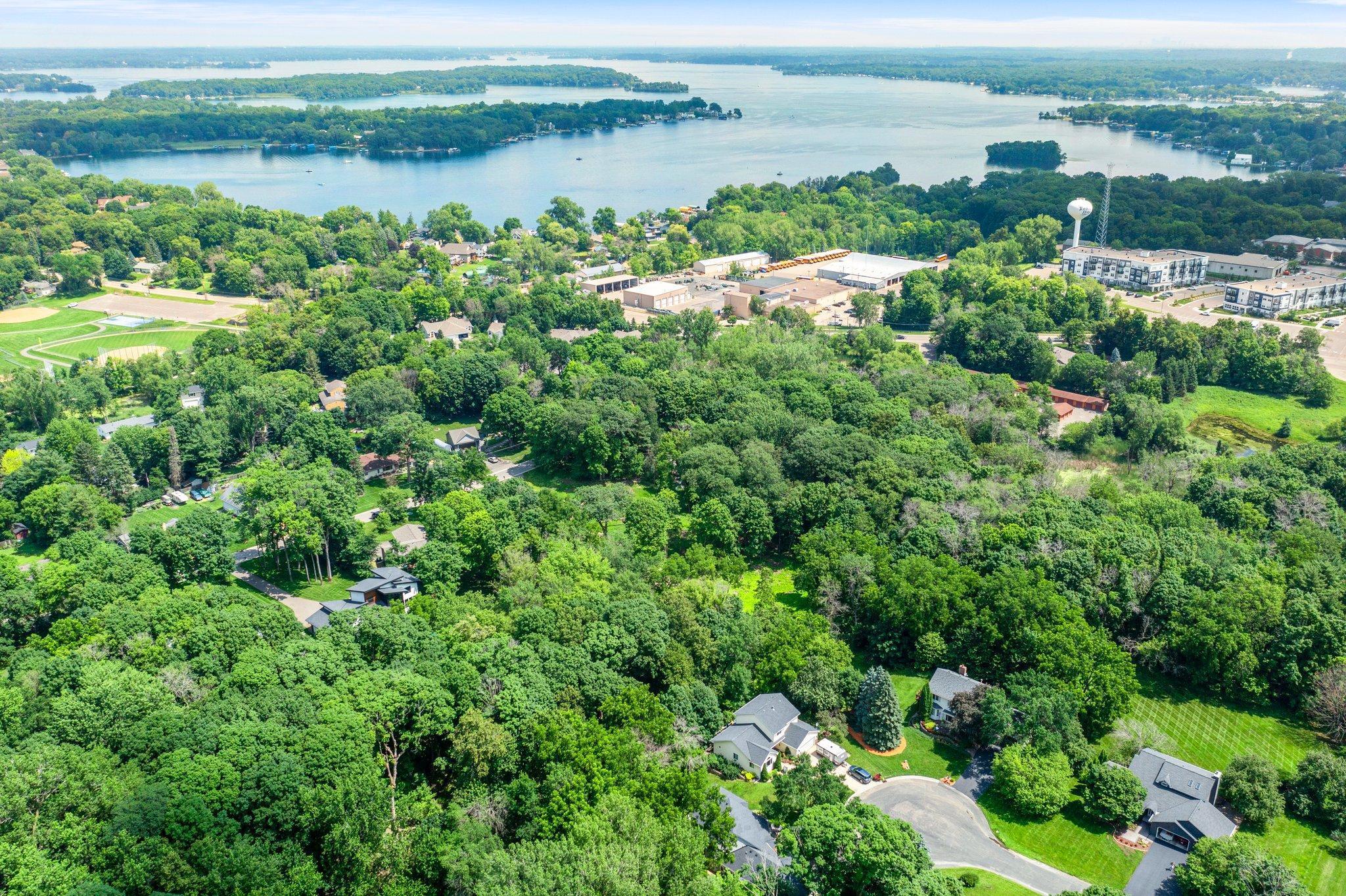 This .9-acre property offers exceptional flexibility and investment potential. Nestled on a level, fully fenced lot just minutes from the Lake Minnetonka LRT Trail and vibrant downtown Excelsior. Originally consisting of two separate parcels, it can be reconfigured back into this arrangement through a Minor Subdivision. Each lot would be approximately 0.9 acres. Whether you're looking to build a custom home on a large estate or develop two individual residences, this property provides a rare opportunity. Located within the highly rated Minnetonka School District, this property offers the perfect blend of location, lifestyle, and long-term potential—just minutes from local dining, boutique shopping, and year-round community events.