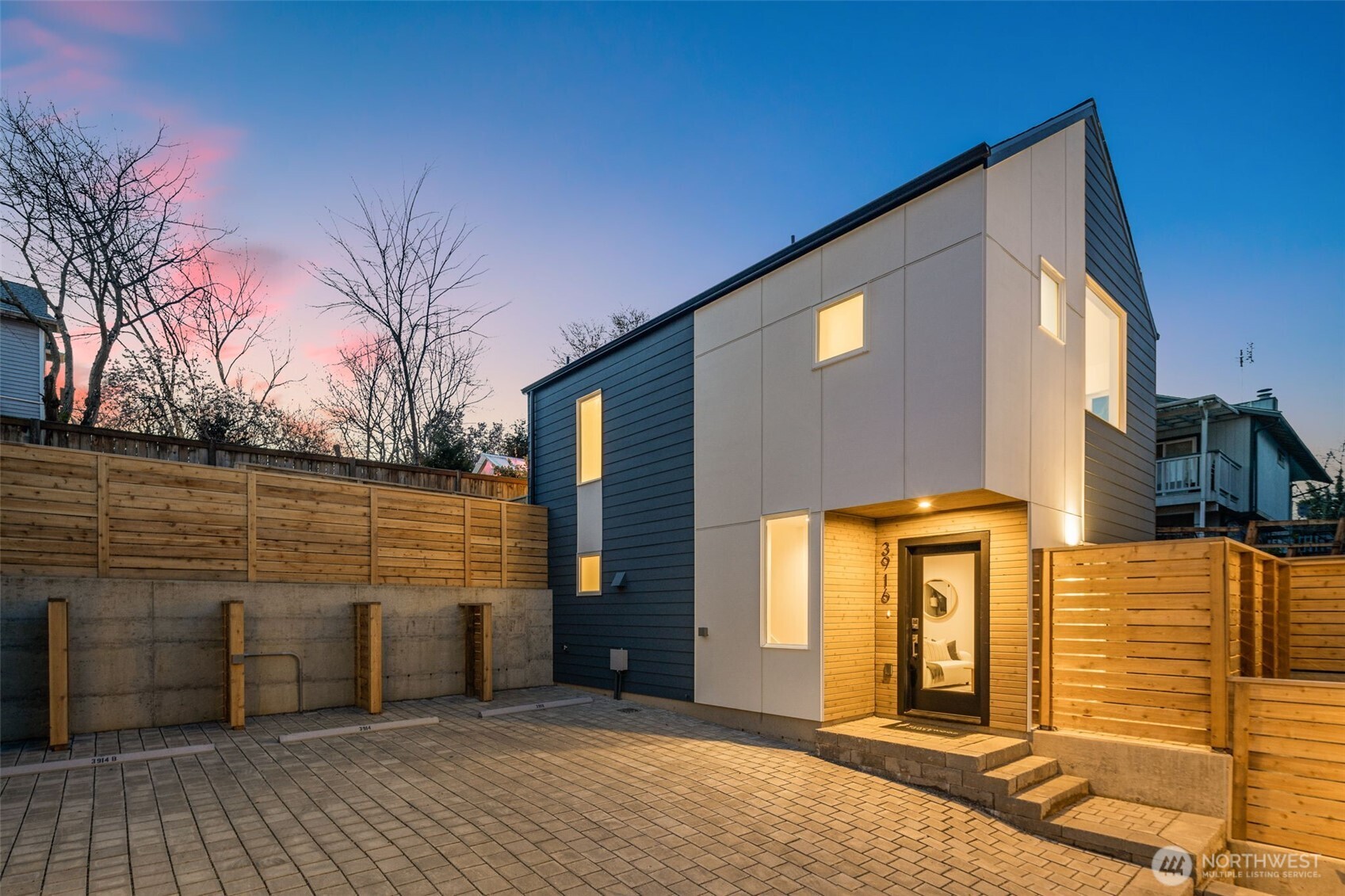 **2% SELLER CREDIT AVAILABLE!** Welcome to Dogwood Hollow, a thoughtfully designed new construction community by Blackwood Homes. This standalone residence offers the privacy and feel of a single-family home paired with a low-maintenance lifestyle. Clean modern finishes, abundant natural light, and an intentional two-level layout create a home that feels both stylish and comfortable. The open-concept main floor seamlessly connects the kitchen, dining, and living areas. A generous quartz island anchors the kitchen, providing plenty of room for meal preparation, casual dining, and gathering with friends. The living area opens directly to a private patio and yard space, creating an inviting spot for morning coffee, outdoor dining, or relaxing at the end of the day. A conveniently located powder room completes the main level. Upstairs, the spacious primary suite features a walk-in closet and private bath, while the secondary bedroom has access to a full hall bath. Conveniently located upstairs laundry adds to the home’s everyday livability. Engineered hardwood flooring, ceramic tile, insulated windows, and efficient ductless heating and cooling provide year-round comfort. Additional highlights include a dedicated EV-wired parking space and a 2-10 Home Warranty for added peace of mind. Ideally located directly across from Brighton Playfield and close to Genesee Playfield, neighborhood cafés and restaurants, Columbia City shopping & dining, and convenient access to I-5 and I-90.